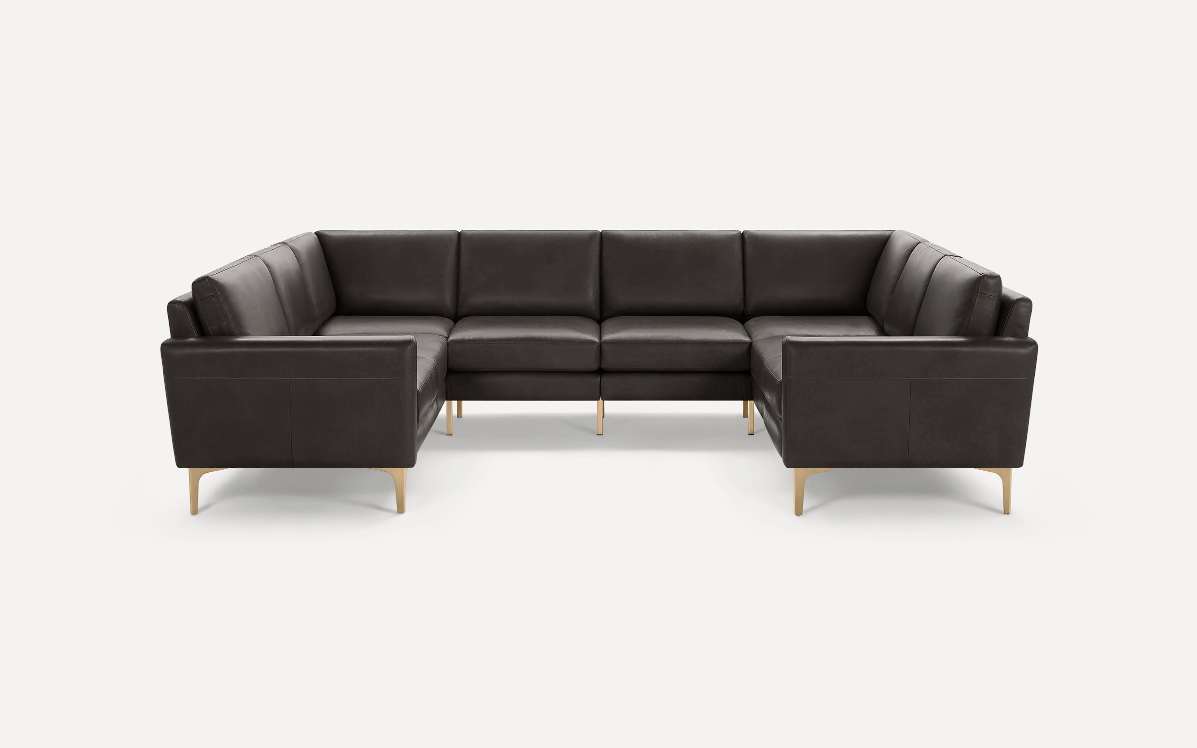 Dark gray L-shaped sectional sofa with clean lines, cushioned seats, and slender light wooden legs on a white background.