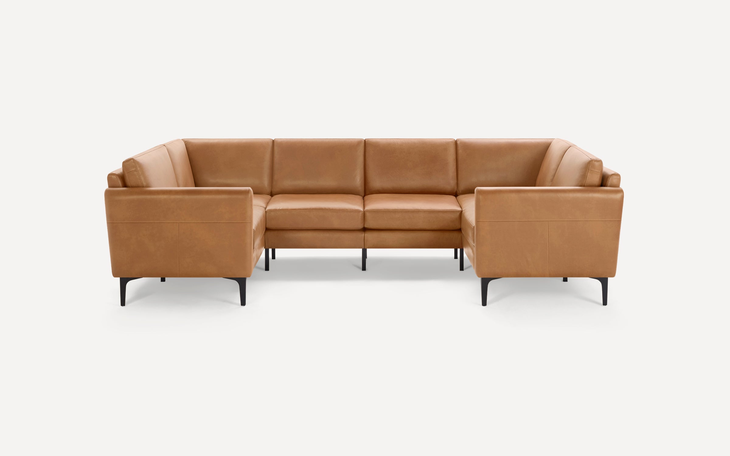 Modern U-shaped sectional sofa with caramel-colored leather upholstery and sleek black metal legs, set against a plain white background.