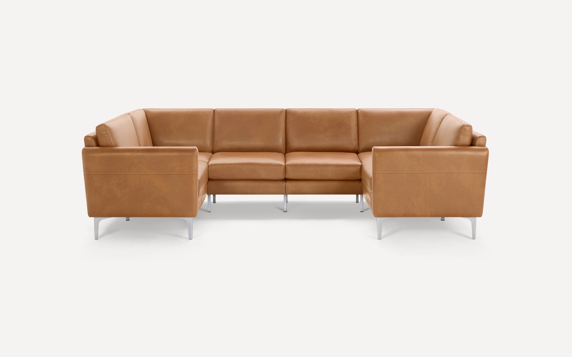 Modern L-shaped sectional sofa in light brown leather with clean lines and slim silver metal legs on white background.