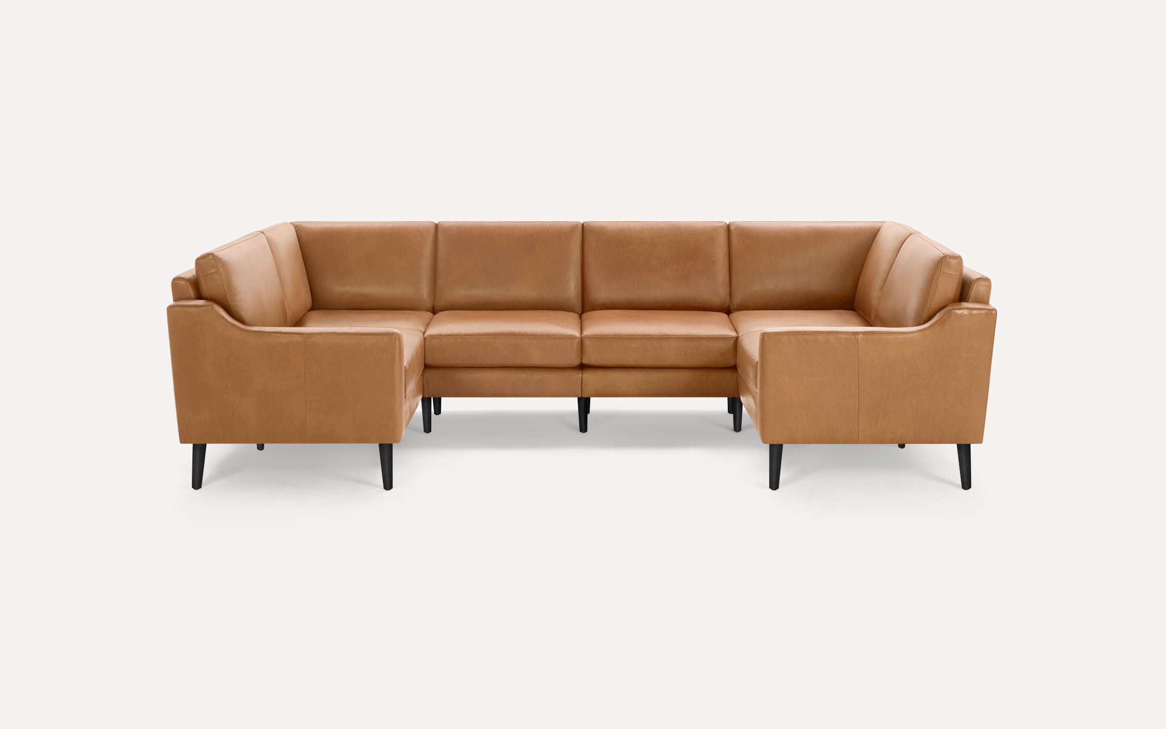 Modern U-shaped sectional sofa in tan leather with clean lines and black tapered legs on a white background.
