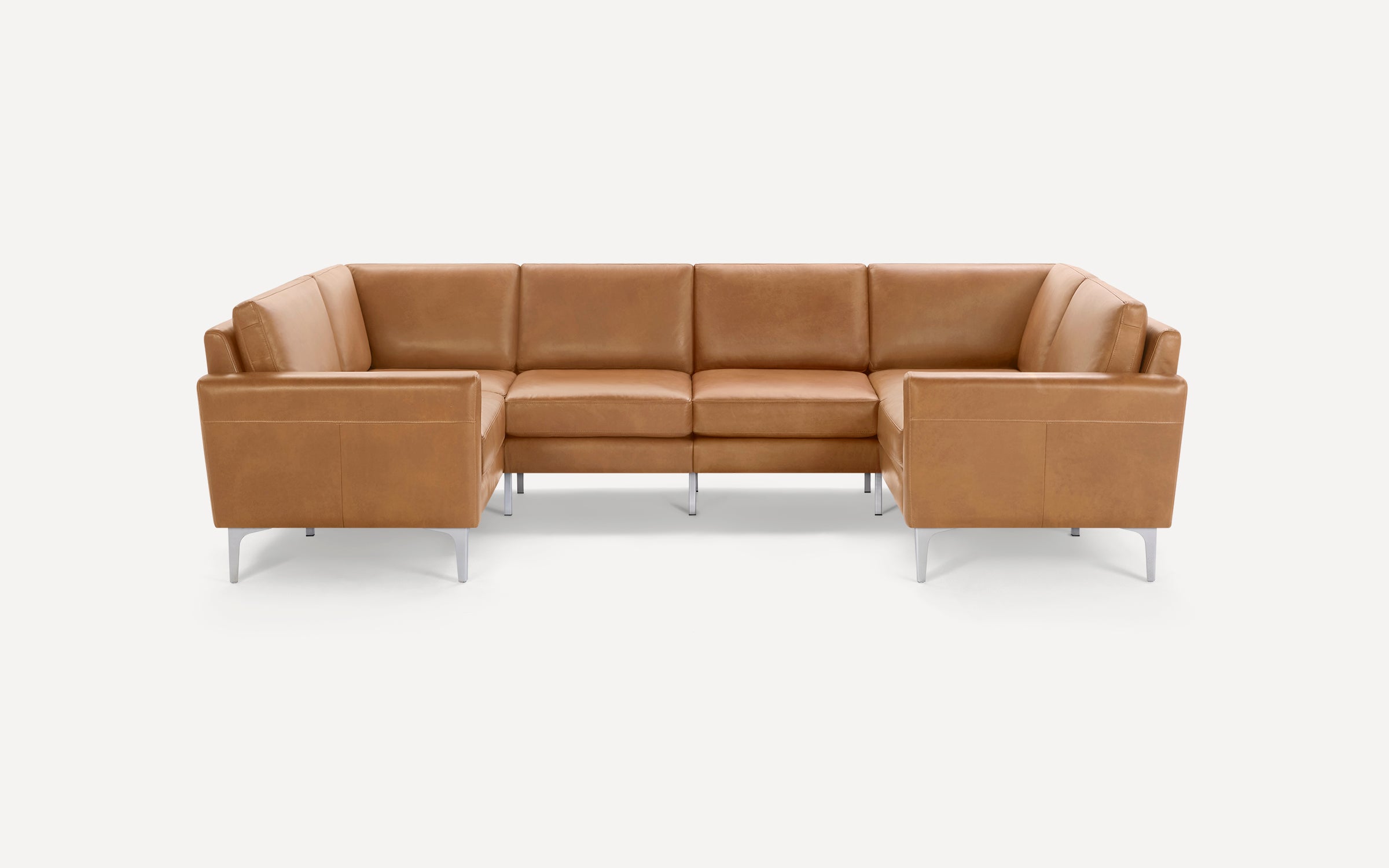 Modern L-shaped sectional sofa with tan leather upholstery and sleek metal legs, designed for spacious seating.