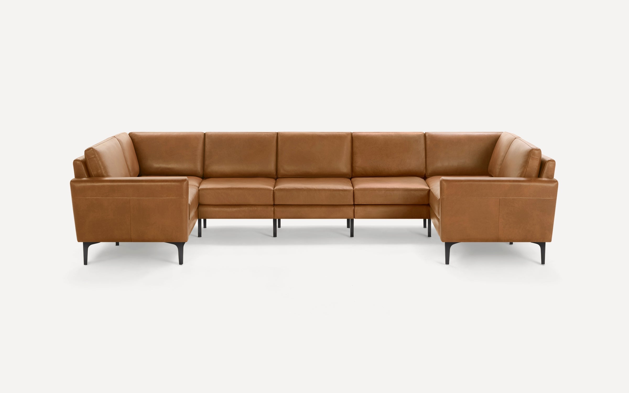 Brown leather U-shaped sectional sofa with sleek black legs, modern design, and cushioned seats and backrests.