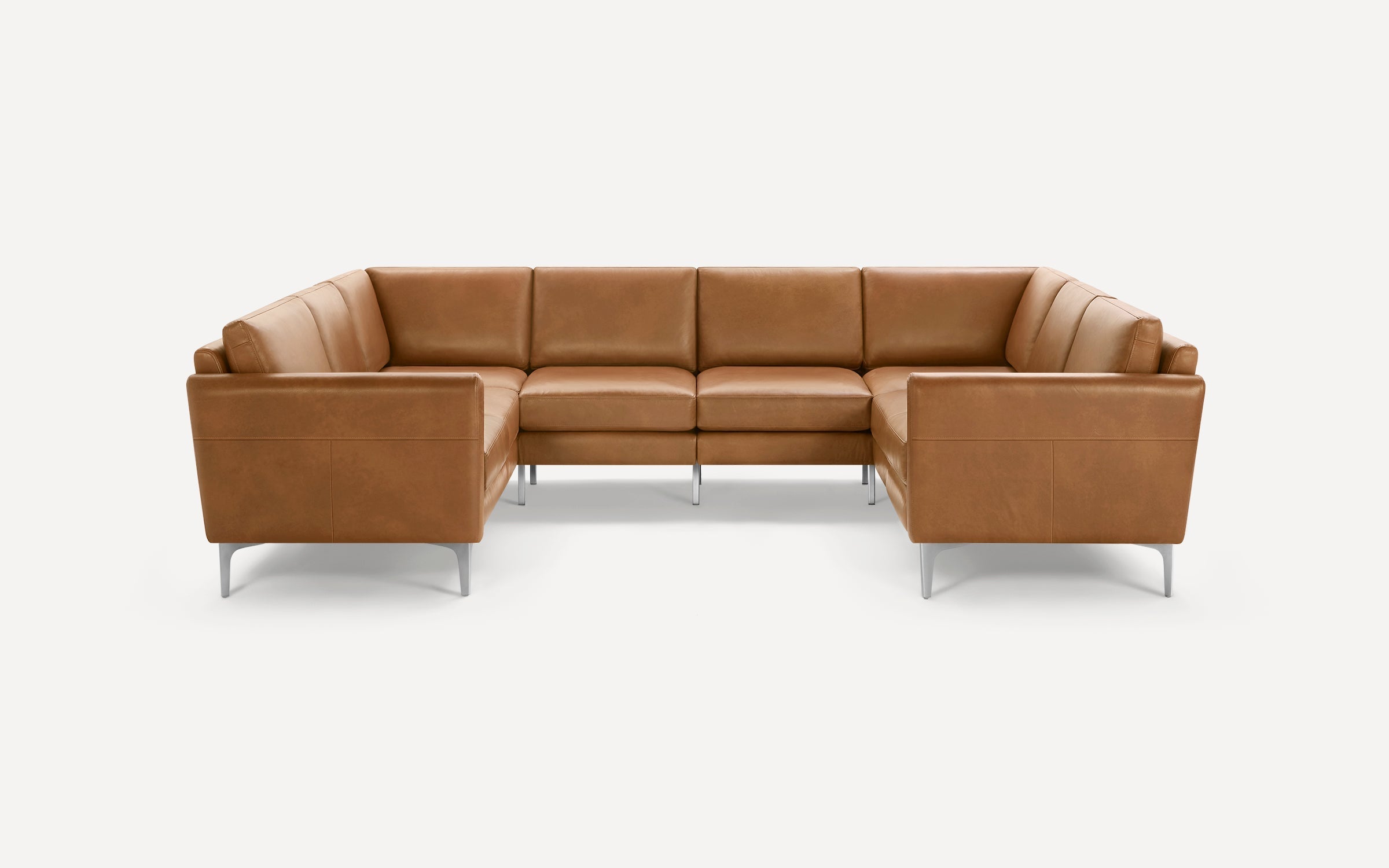 Modern U-shaped sectional sofa in tan leather with clean lines and metal legs, designed for spacious seating.