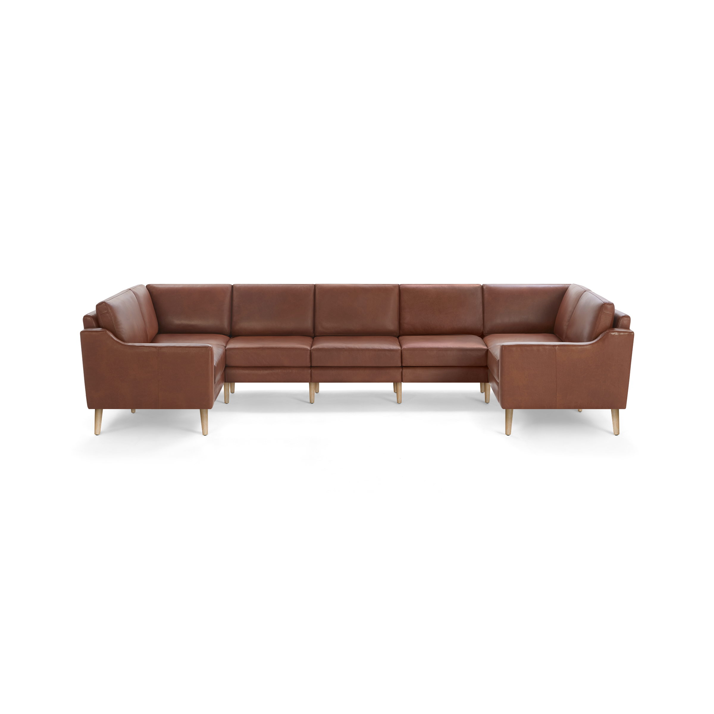 Large brown leather sectional sofa with wooden legs, featuring clean lines and cushioned seating for multiple people.
