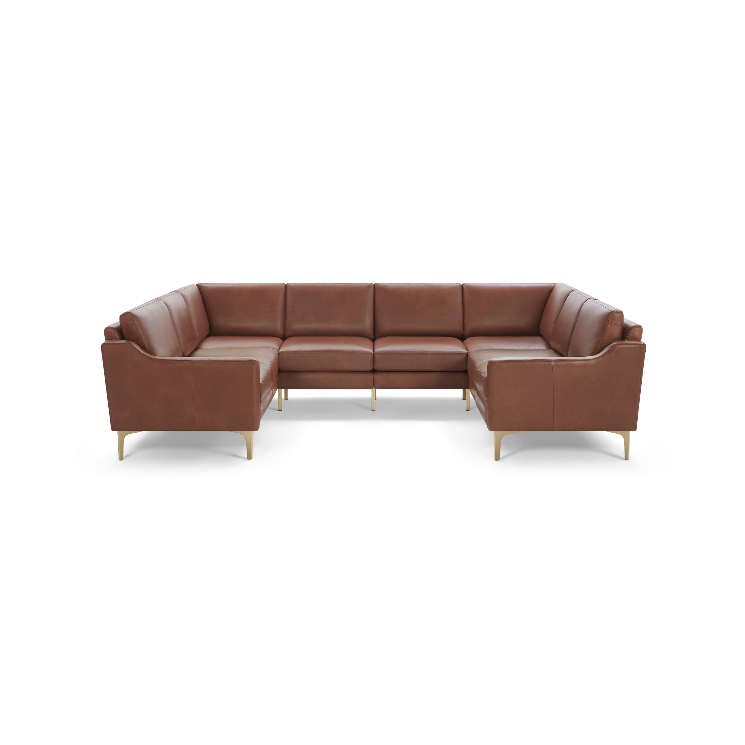 Large L-shaped sectional sofa in brown leather with cushioned seats and backrests, supported by slim wooden legs.