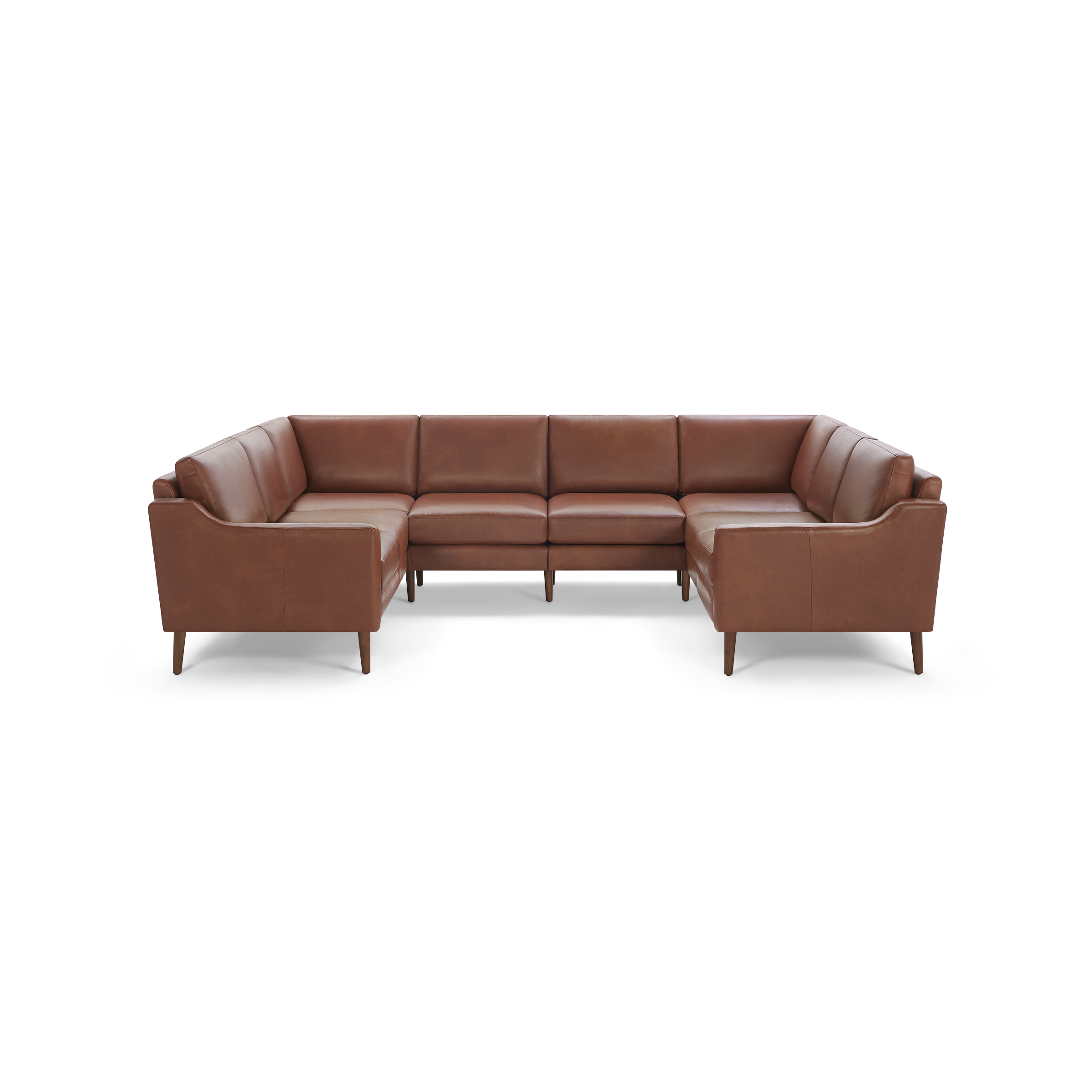 Brown leather U-shaped sectional sofa with wooden legs and cushioned seats and backrests, modern mid-century design.