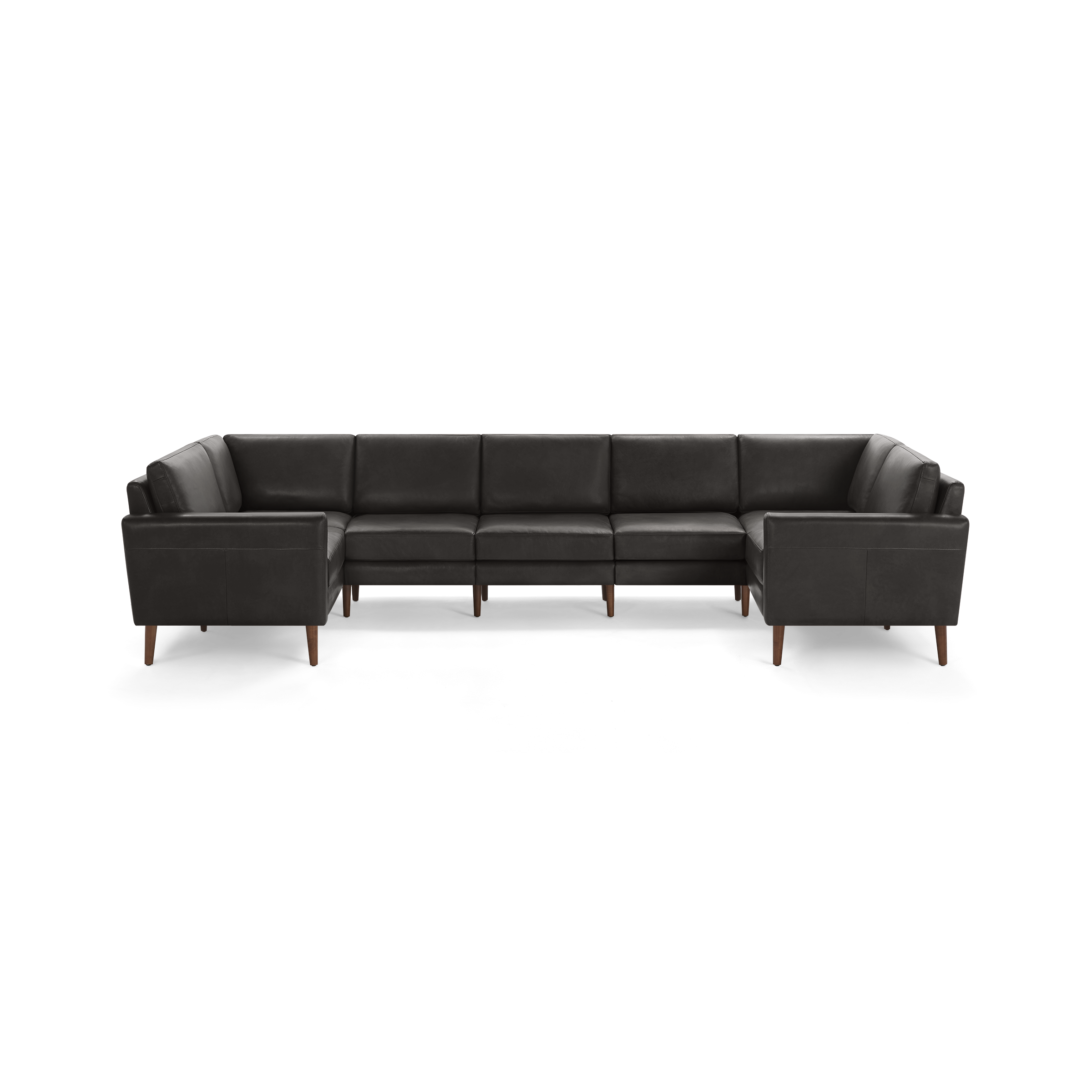 Large sectional sofa with dark gray leather upholstery and wooden legs, featuring a modern, boxy design with cushioned seats and backrests.