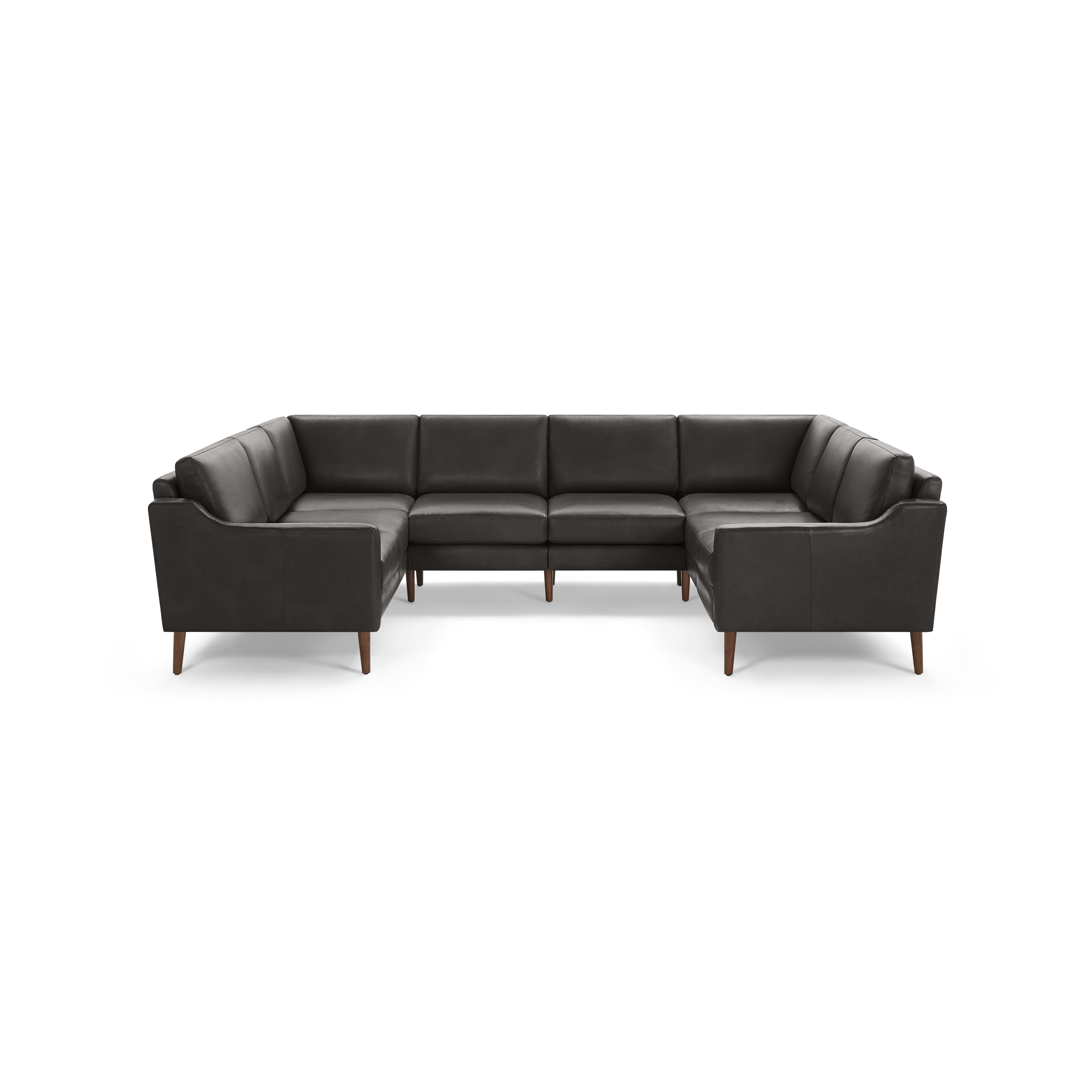 Modern dark gray leather U-shaped sectional sofa with cushioned seats and wooden tapered legs on black background.
