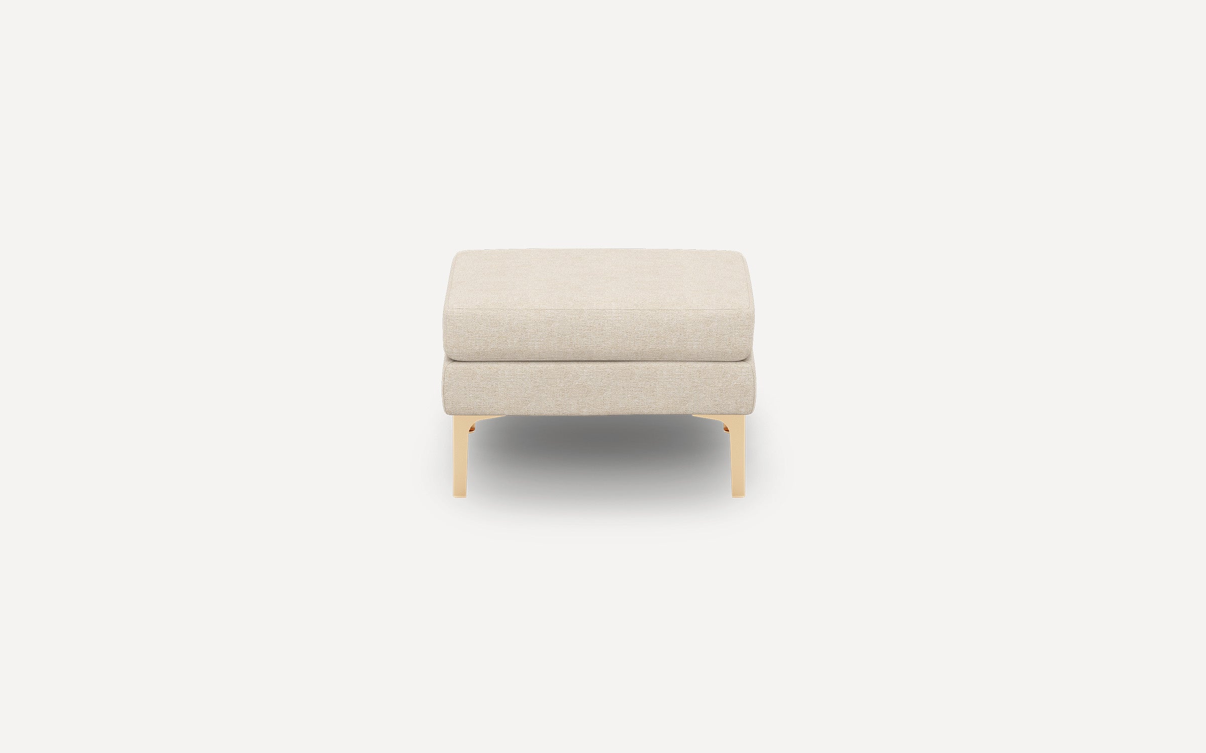 Beige upholstered square ottoman with light wooden legs, shown from the front on a plain white background.