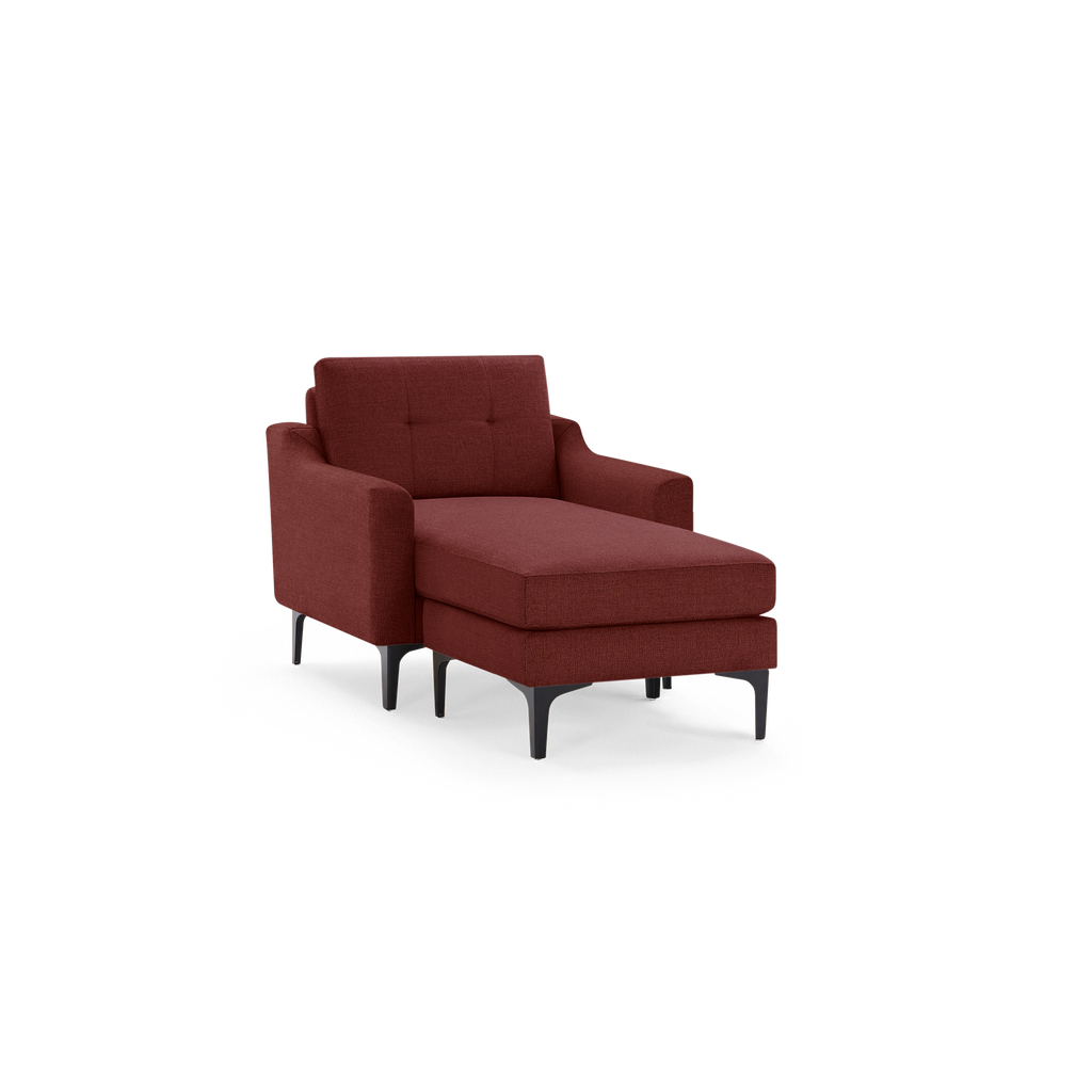 Modern chaise lounge chair in dark red fabric with tufted backrest and black slim metal legs, designed for comfort and style.