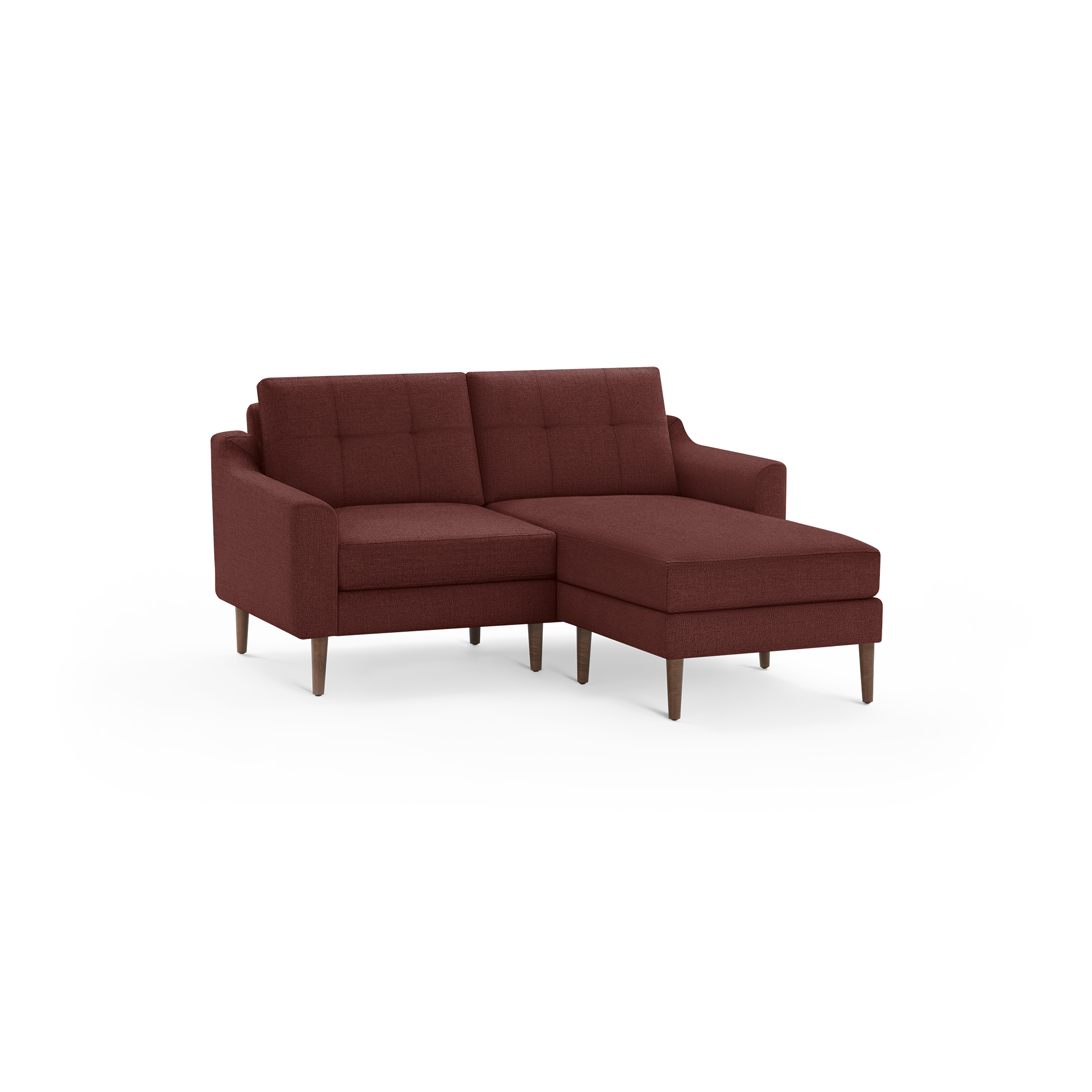 Modern rust-colored sectional sofa with tufted back cushions, angled arms, and wooden tapered legs, featuring a chaise lounge on the right side.