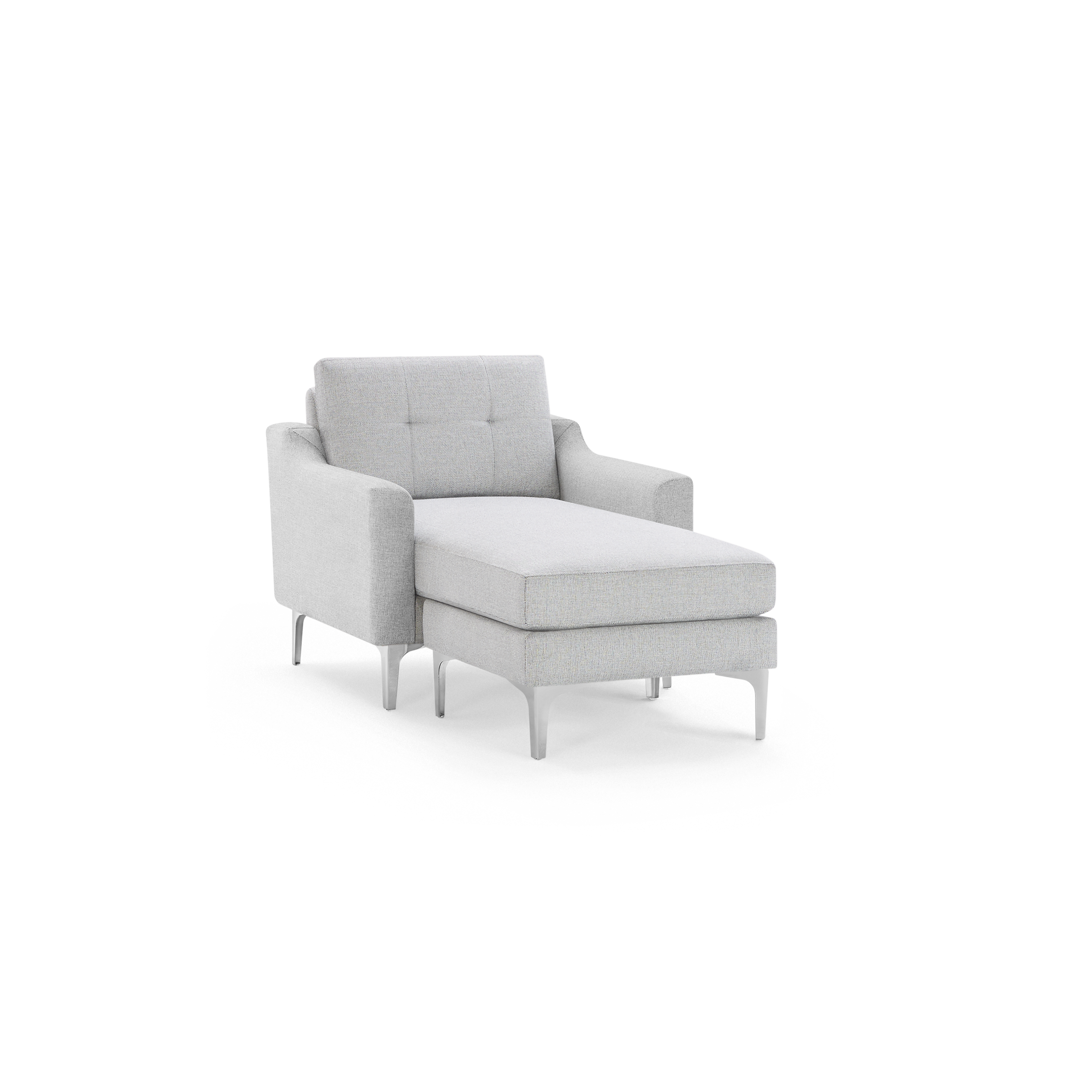 Light gray upholstered chaise lounge chair with tufted backrest, angled armrests, and slim metal legs, isolated on black background.