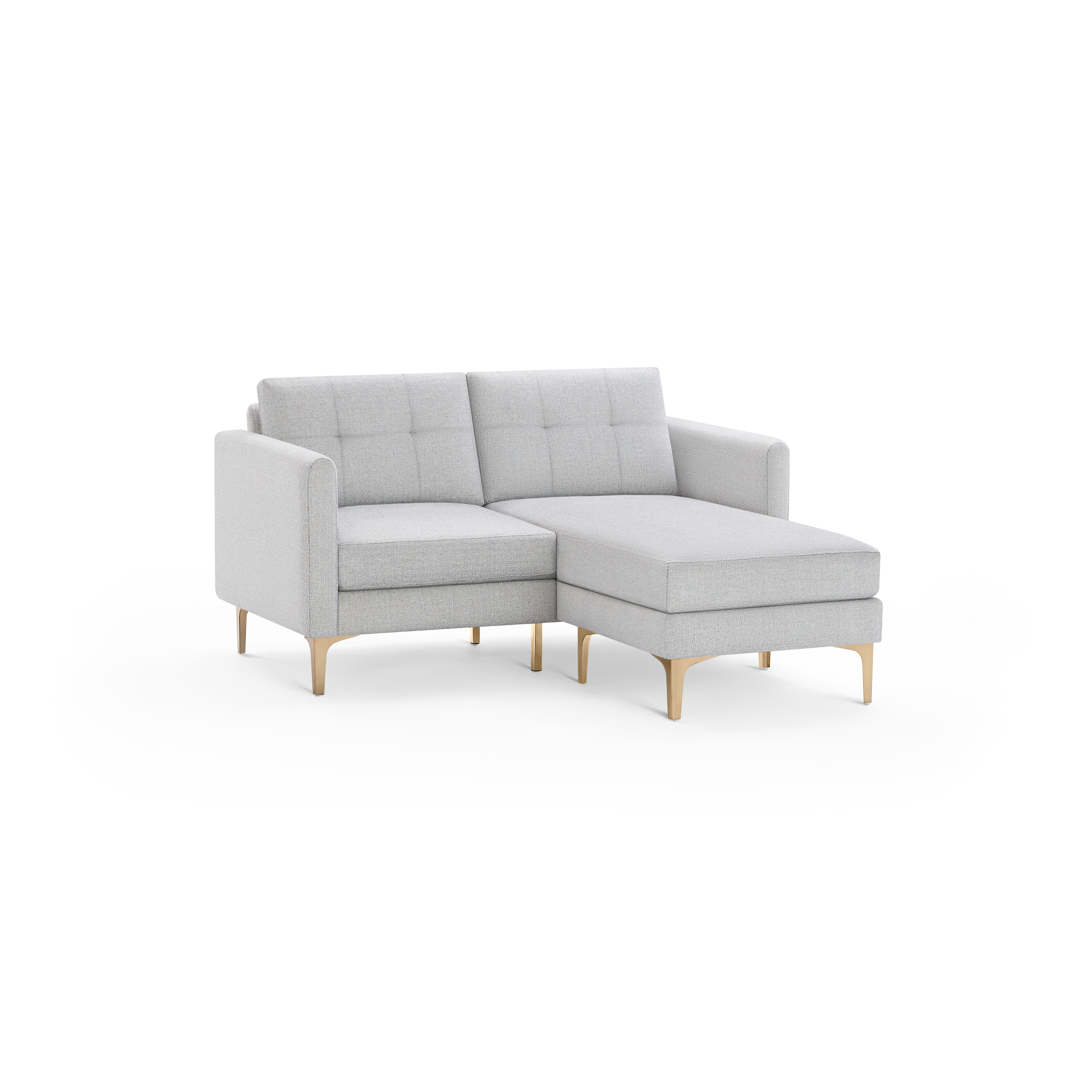 Light gray upholstered sectional sofa with tufted back cushions and sleek wooden legs, featuring a right-side chaise lounge.