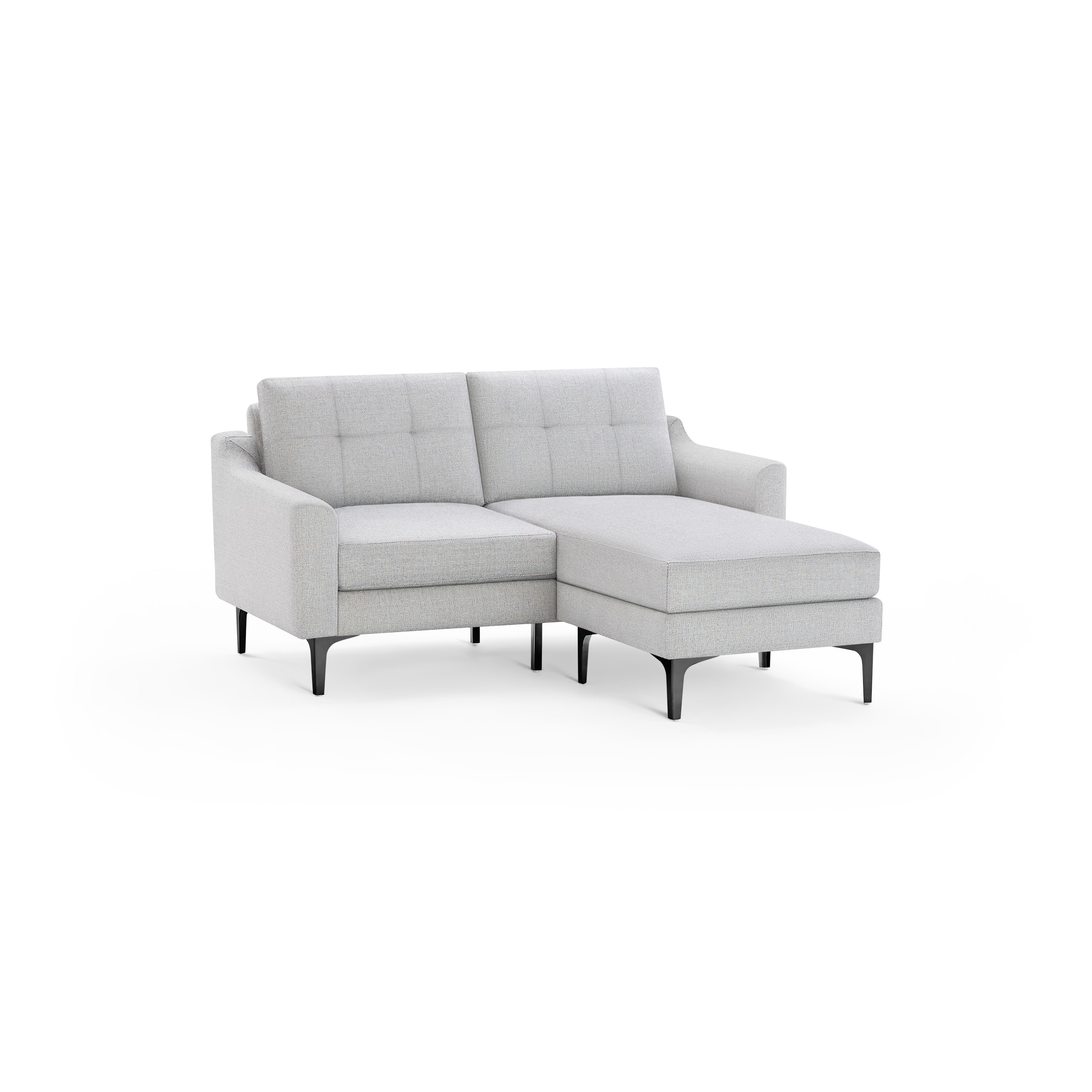 Light gray fabric sectional sofa with tufted back cushions and black angled legs, featuring a chaise lounge on the right side.