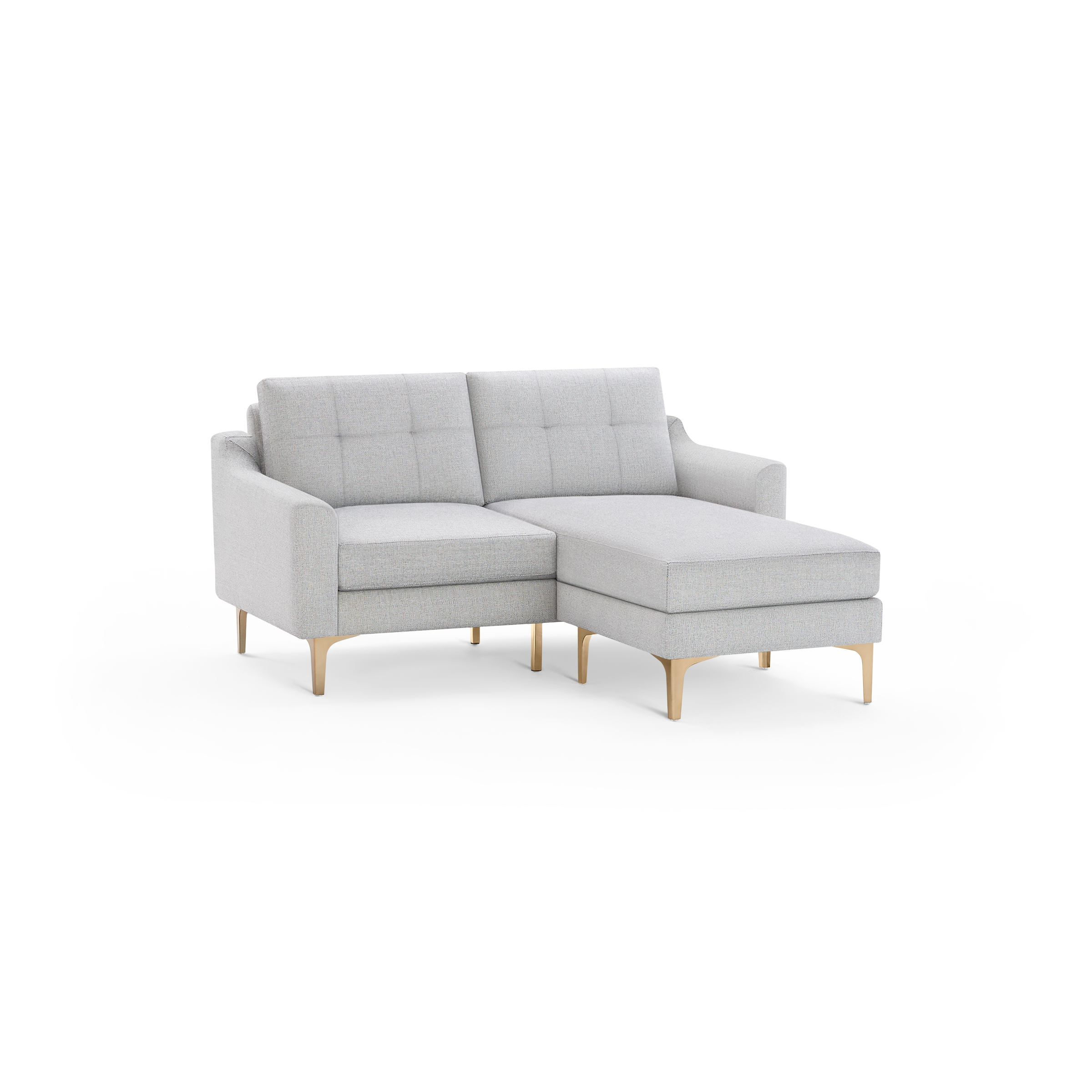 Light gray fabric sectional sofa with tufted back cushions and wooden legs, featuring a chaise lounge on the right side.