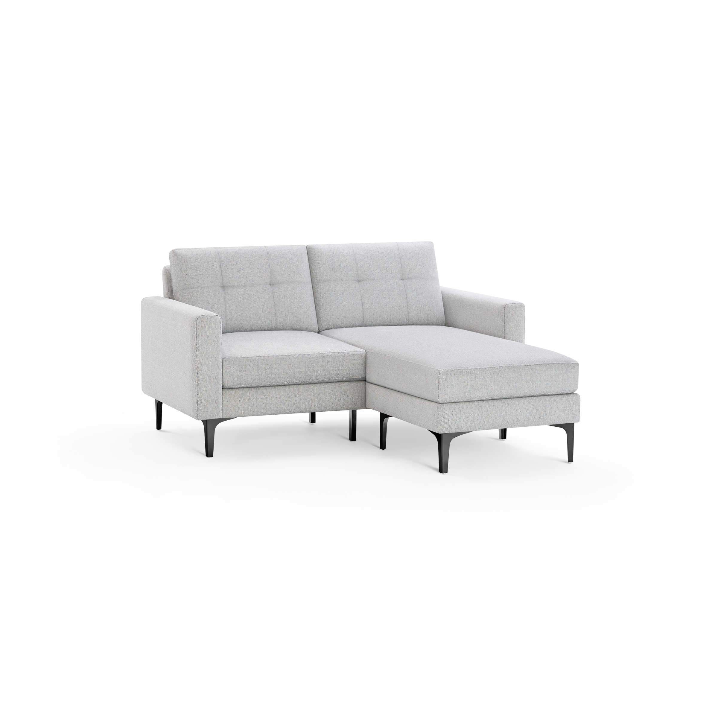 Light gray modern sectional sofa with tufted back cushions, angled armrest, and black slim legs, featuring a chaise on the right side.