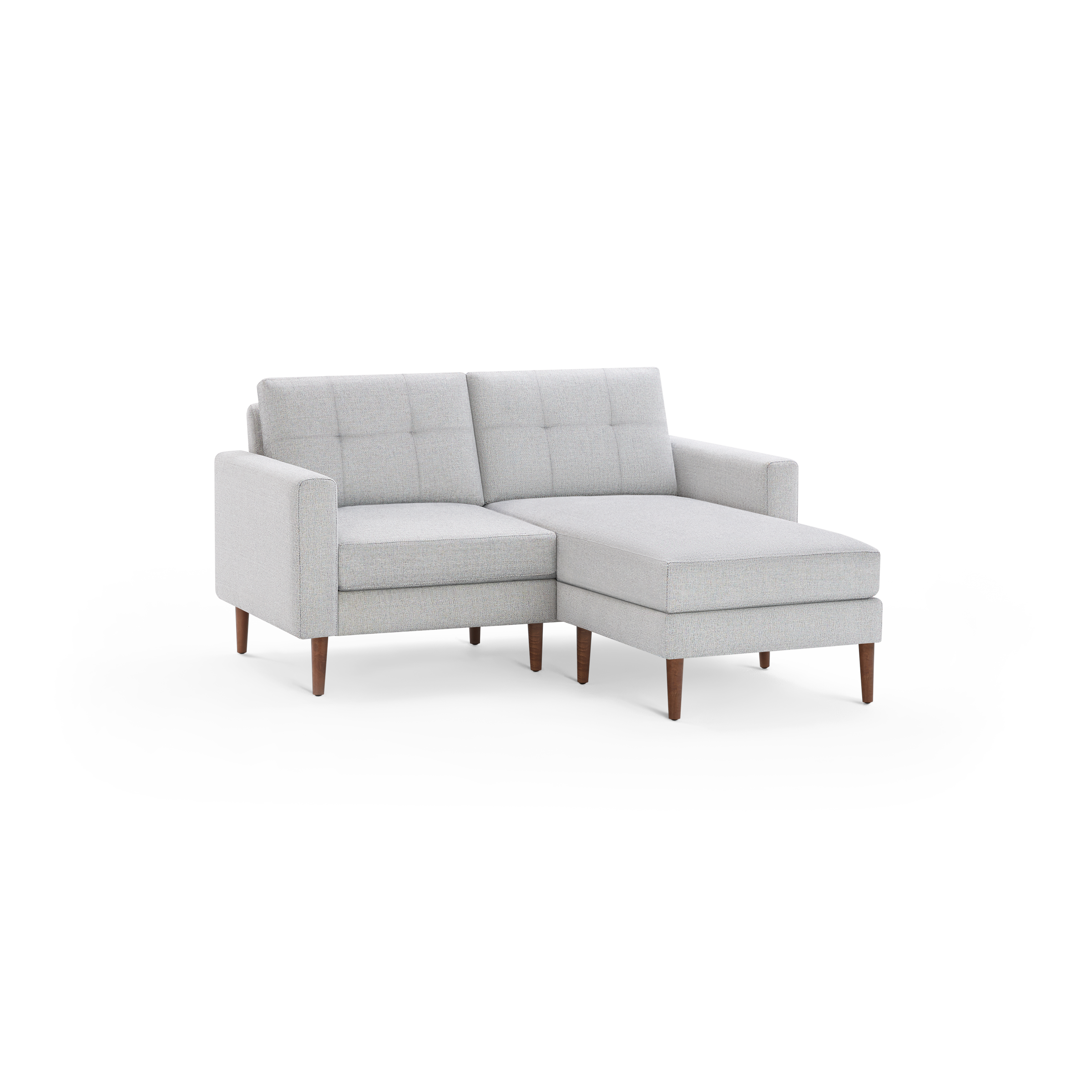 Light gray fabric sectional sofa with tufted back cushions, square arms, and wooden tapered legs on a black background.