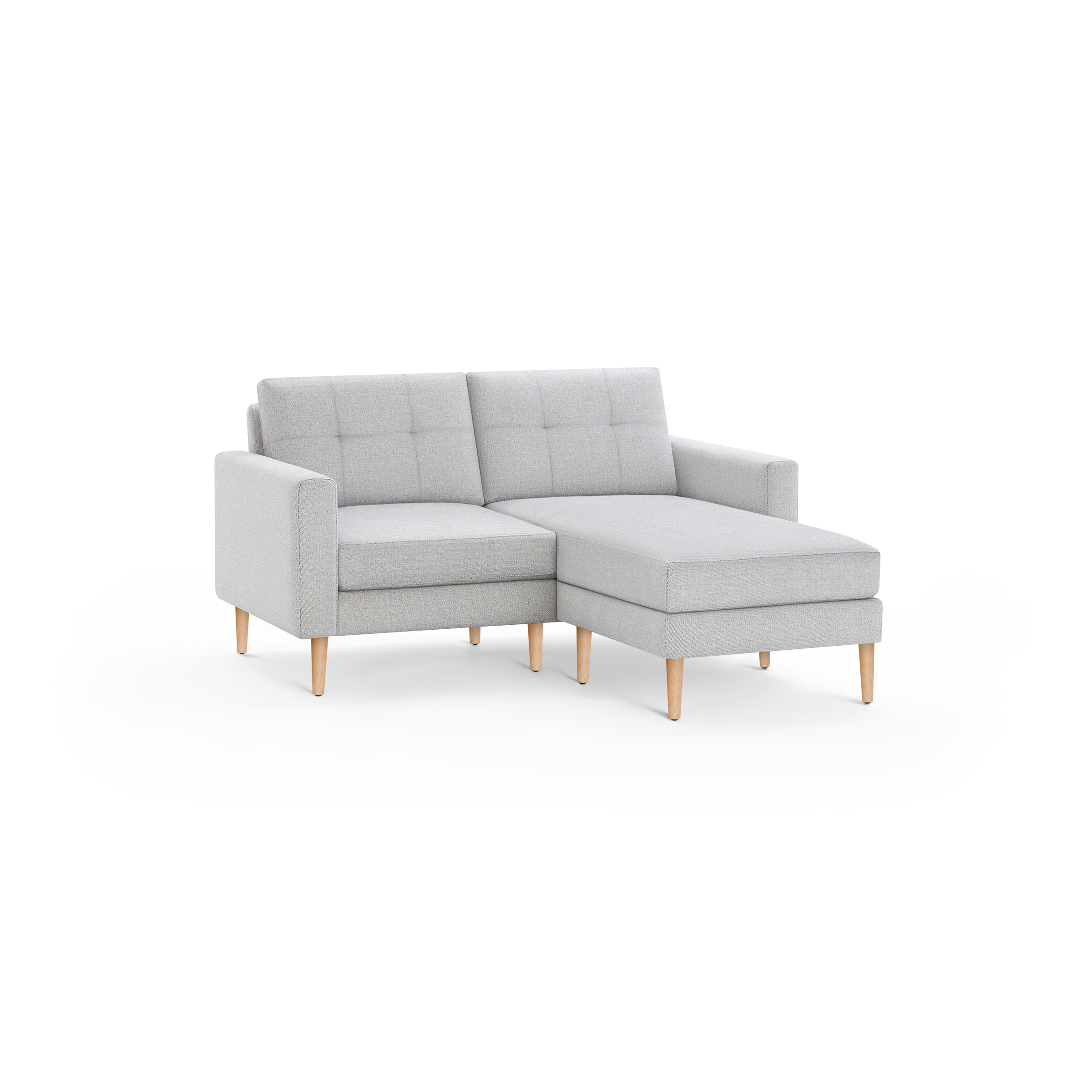 Light gray tufted fabric sectional sofa with wooden legs, featuring a right-side chaise lounge.