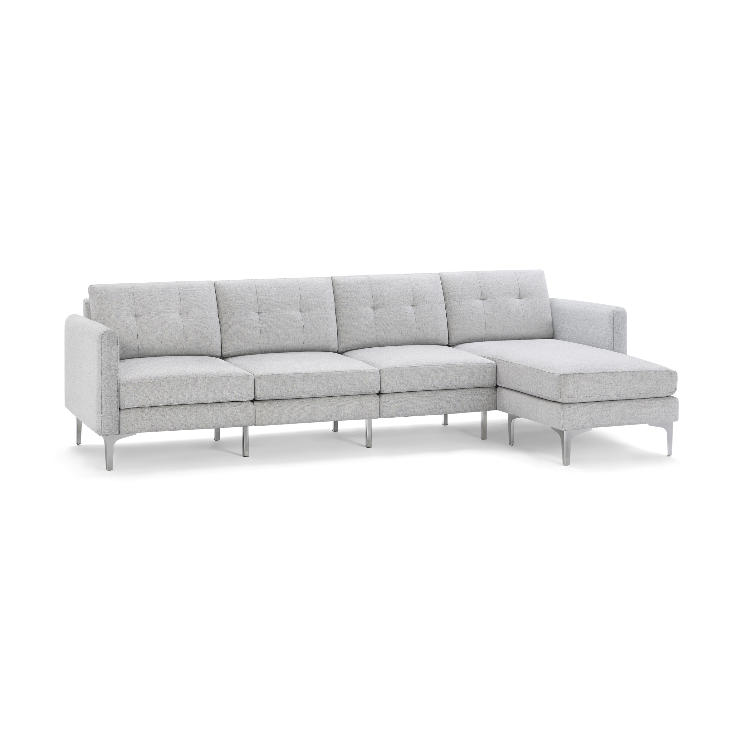 Light gray fabric sectional sofa with tufted back cushions, metal legs, and a right-side chaise lounge.