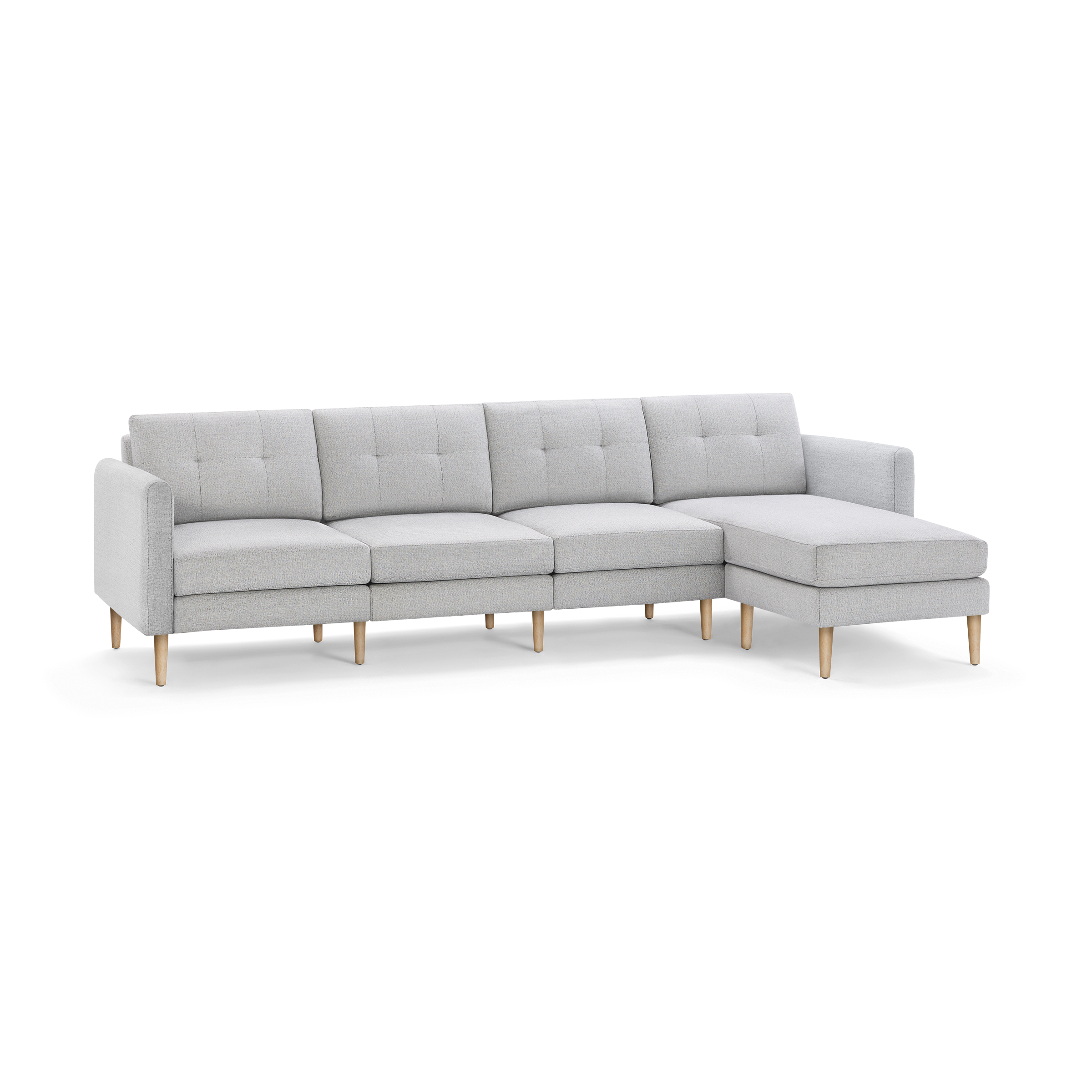 Light gray modern sectional sofa with tufted back cushions, wooden legs, and a right-side chaise lounge.