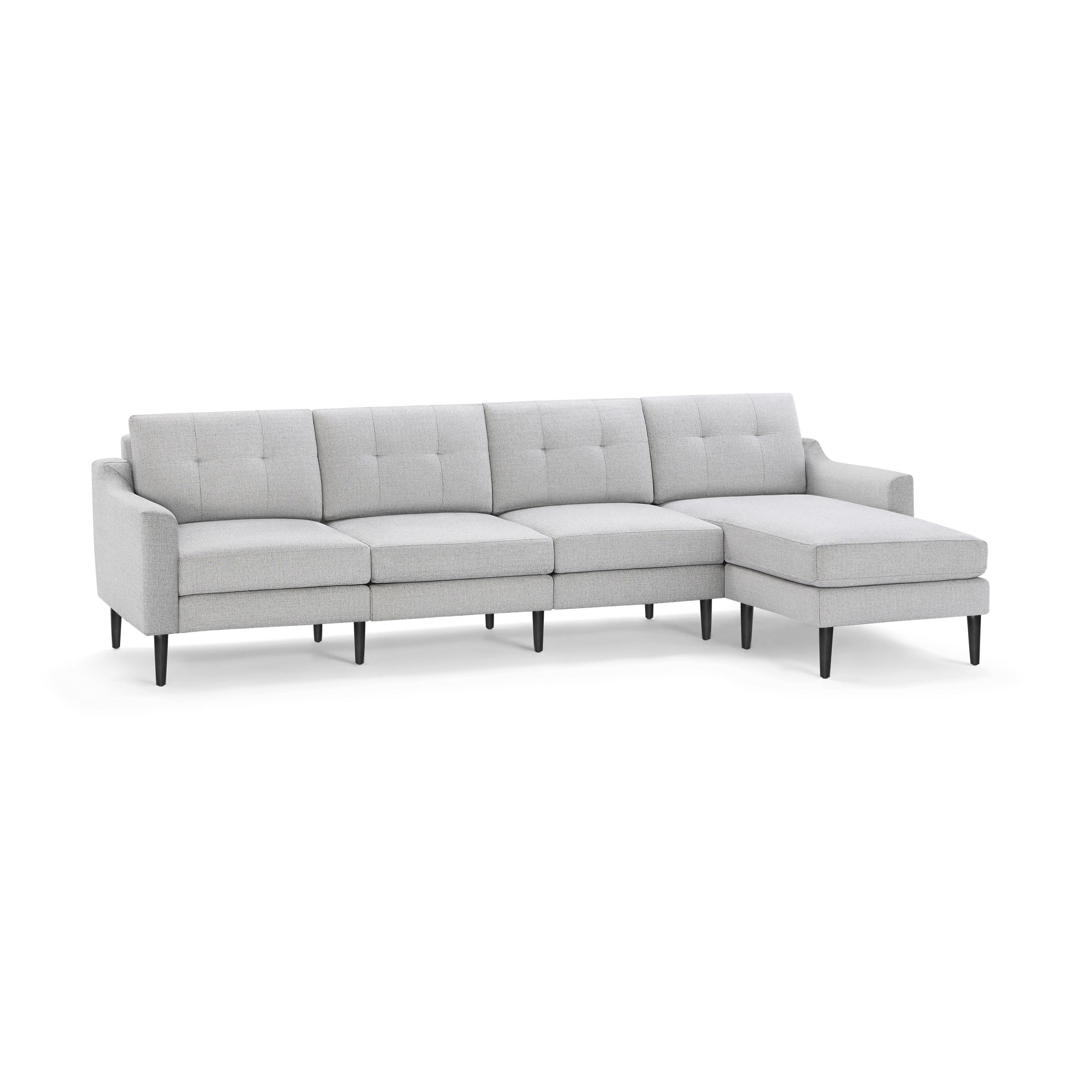 Light gray modern sectional sofa with tufted back cushions, angled armrests, and black tapered legs on a white background.