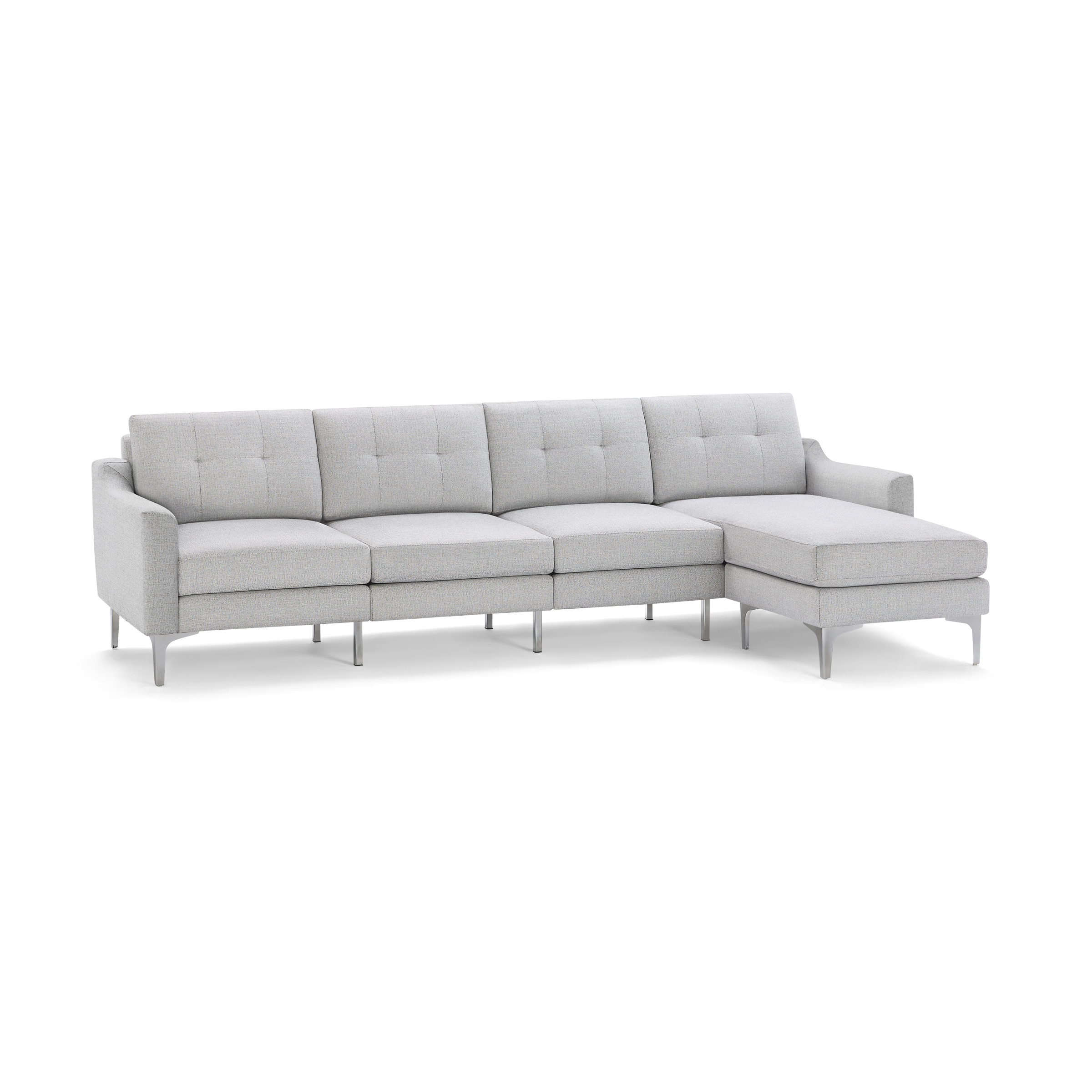 Light gray modern sectional sofa with tufted back cushions, metal legs, and a chaise lounge on the right side.
