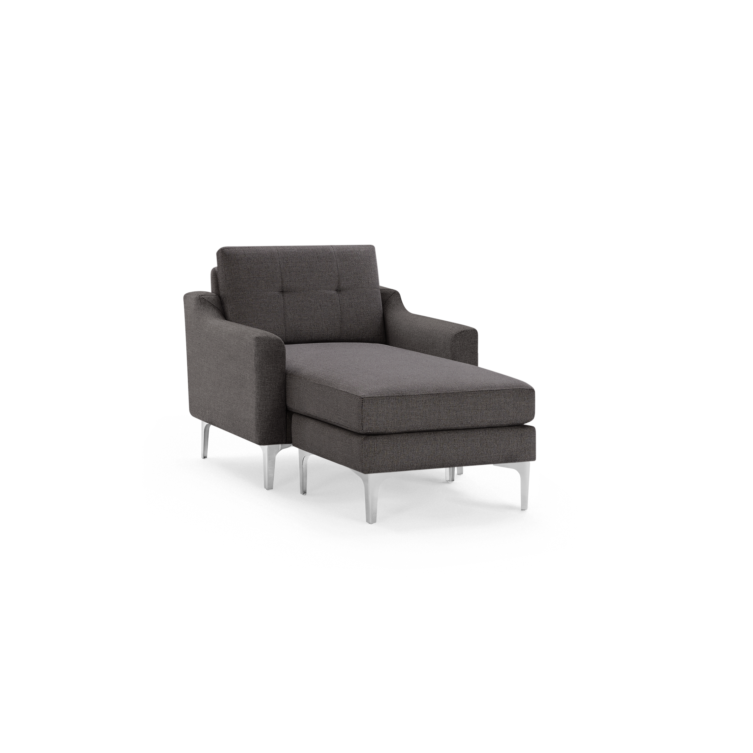 Modern dark gray fabric chaise lounge chair with tufted backrest and sleek silver metal legs, isolated on black background.