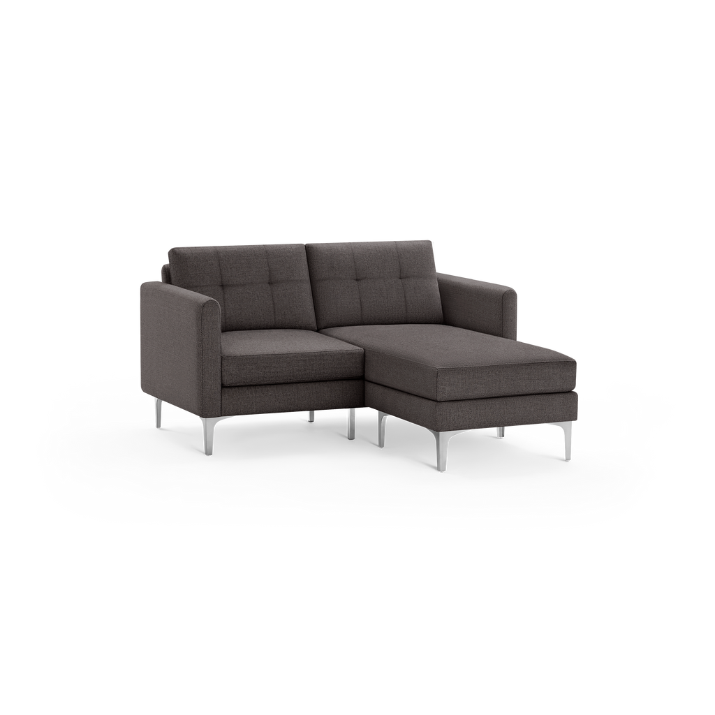 Dark gray fabric L-shaped sectional sofa with tufted back cushions and sleek metal legs, designed for modern living spaces.