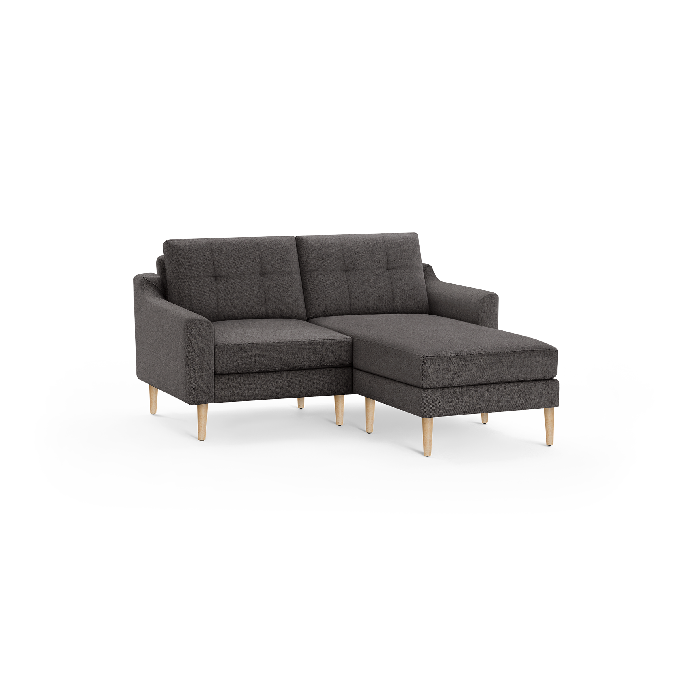 Dark gray fabric sectional sofa with tufted back cushions and light wooden legs, featuring a right-side chaise lounge.