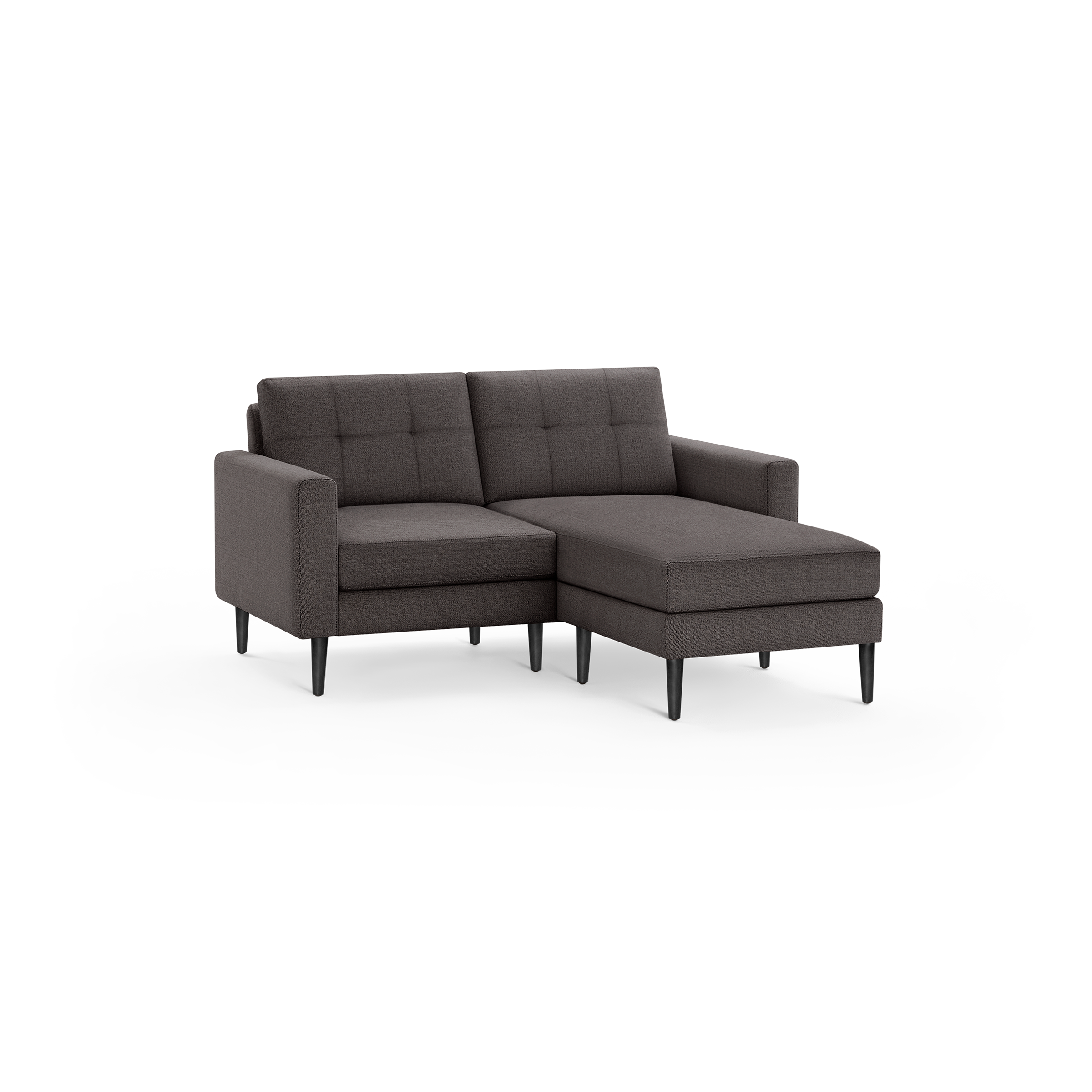 Modern dark gray fabric sectional sofa with tufted back cushions, right chaise, and slender black legs.