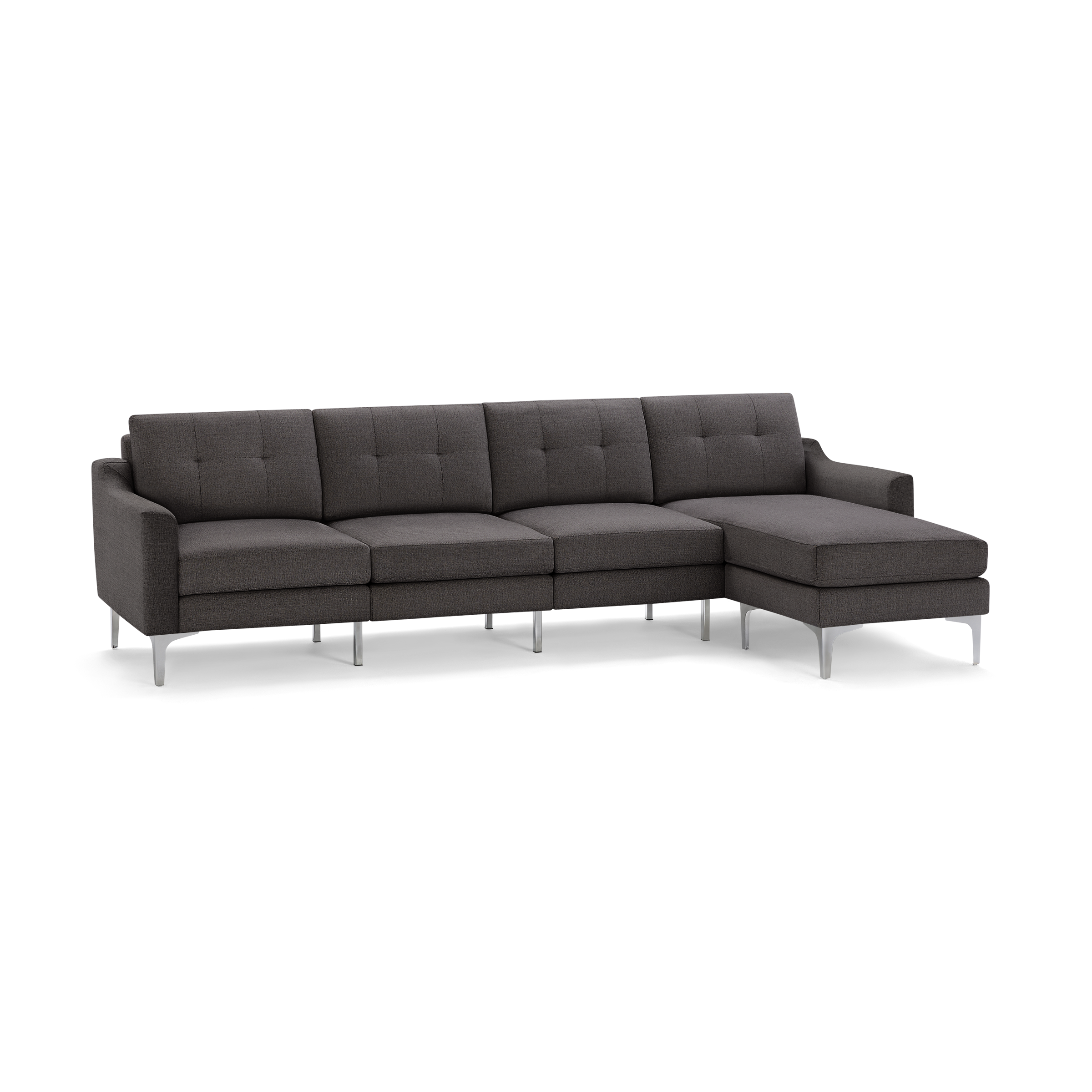 Modern dark gray sectional sofa with tufted back cushions, sleek metal legs, and a chaise lounge on the right side.