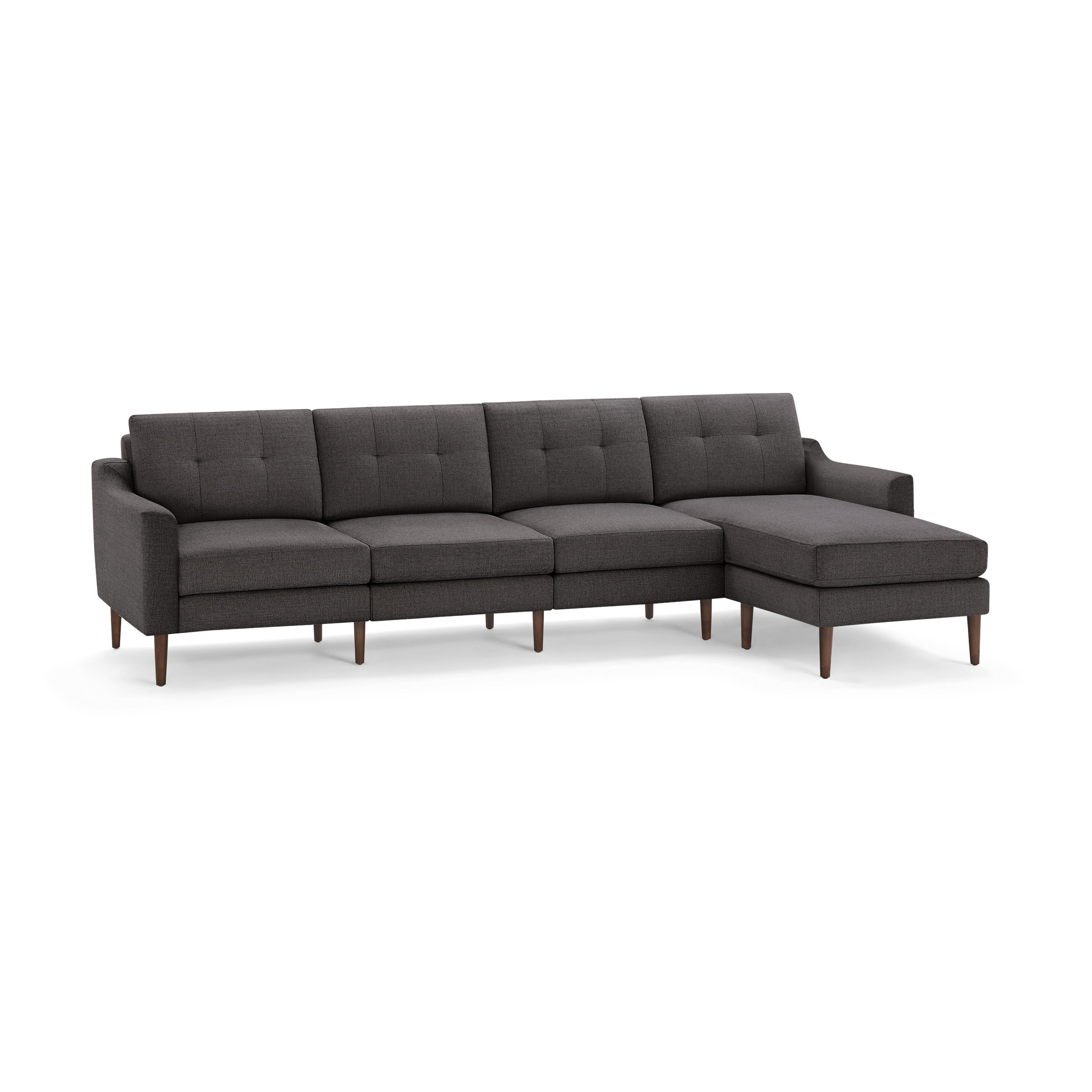 Modern dark gray fabric sectional sofa with tufted back cushions, straight arms, chaise lounge on right side, and wooden tapered legs.