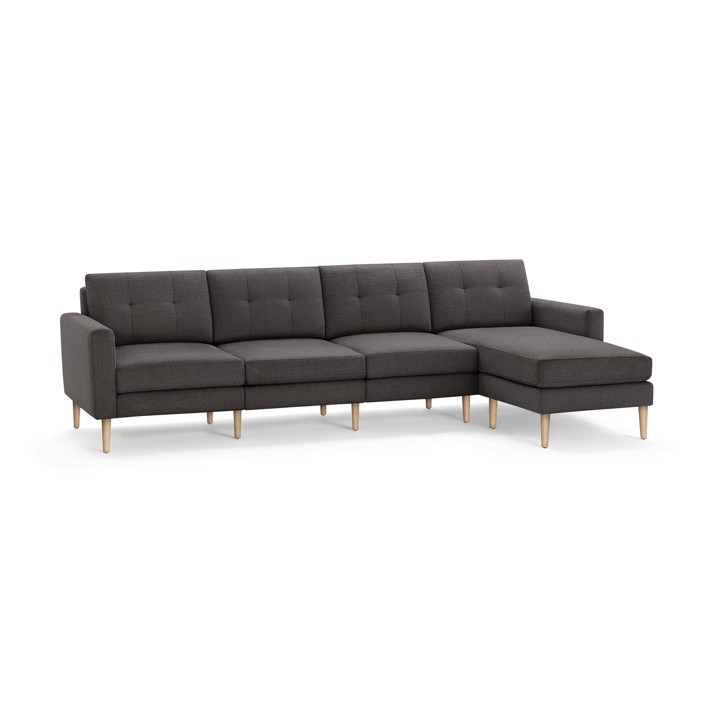 Dark gray sectional sofa with tufted cushions, wooden legs, and a right-side chaise lounge, offering modern minimalist style.