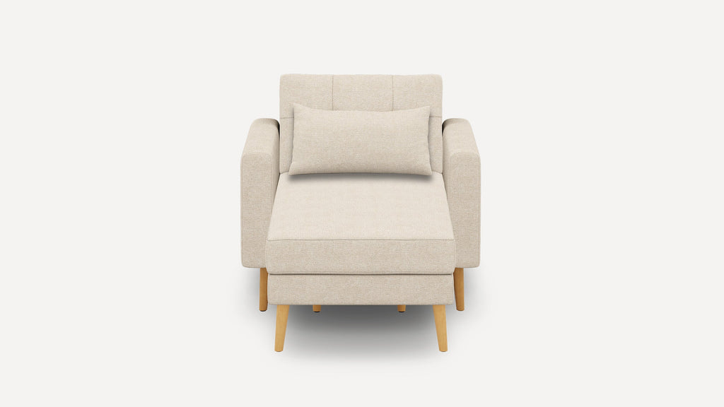 Beige upholstered armchair with wooden legs, featuring a rectangular lumbar pillow and clean, modern design.