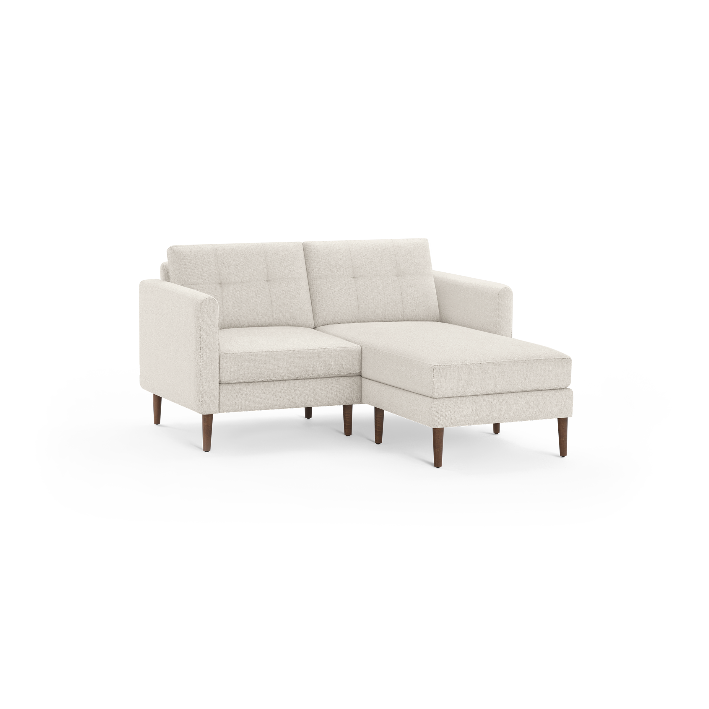 Beige fabric sectional sofa with tufted back cushions, wooden tapered legs, and a chaise lounge on the right side.