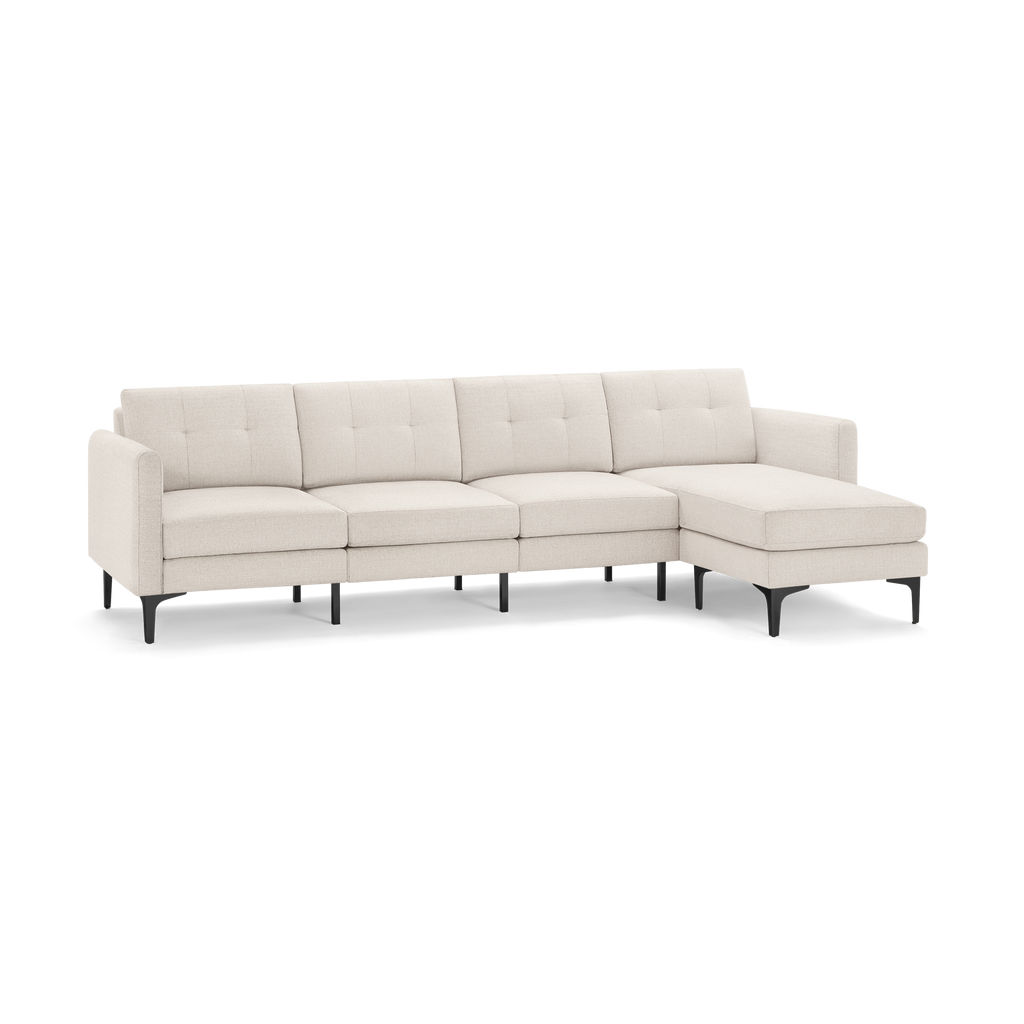 Beige fabric sectional sofa with tufted back cushions, clean lines, and black angled legs, featuring a right-side chaise lounge.
