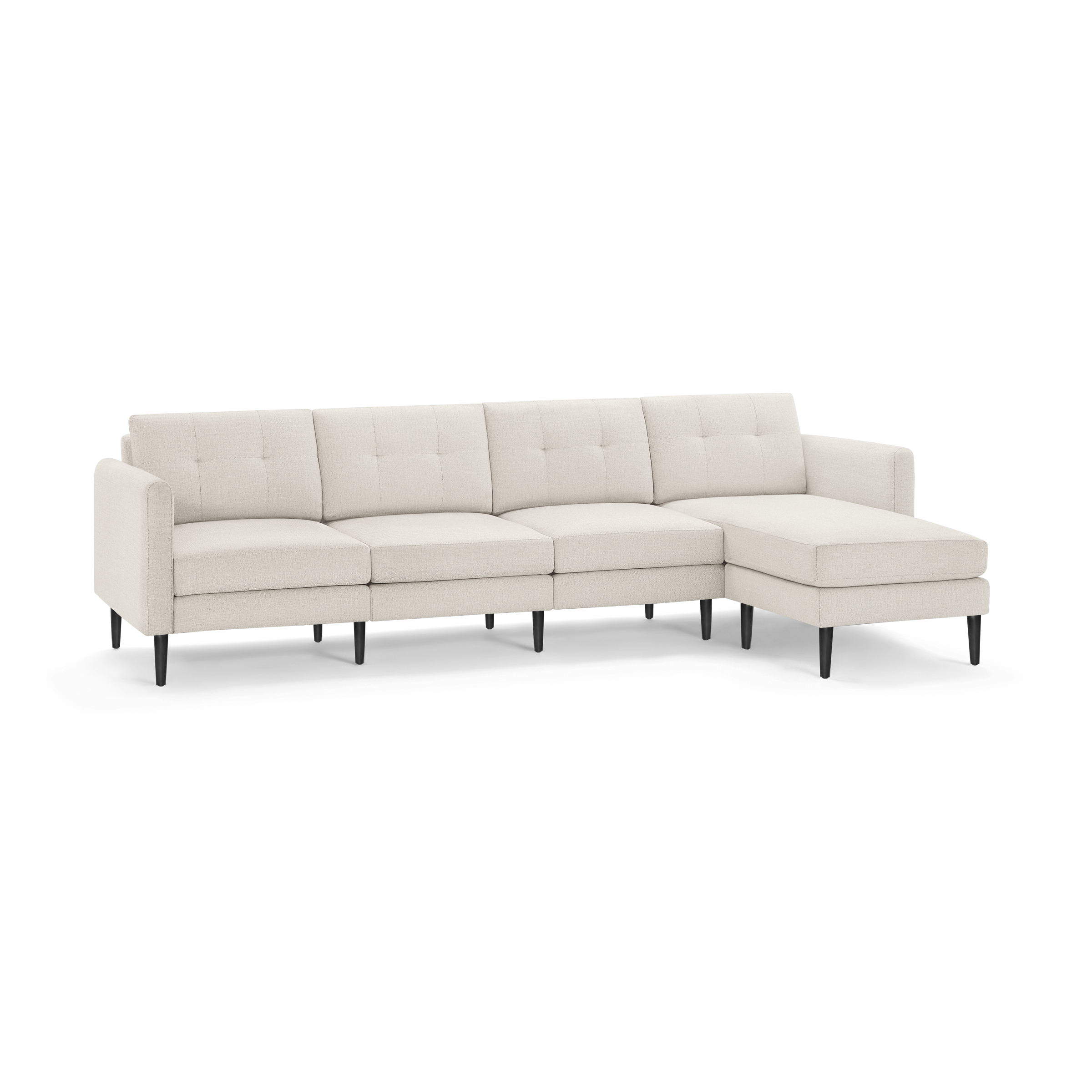 Beige sectional sofa with tufted cushions, right chaise, straight armrests, and black tapered legs on a white background.