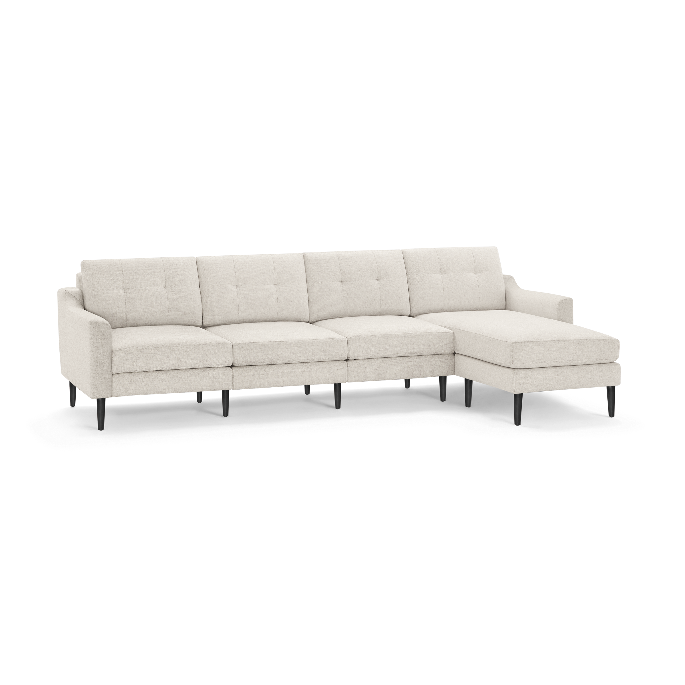 Light beige fabric sectional sofa with tufted back cushions, slim armrests, and black tapered legs, featuring a right-side chaise lounge.