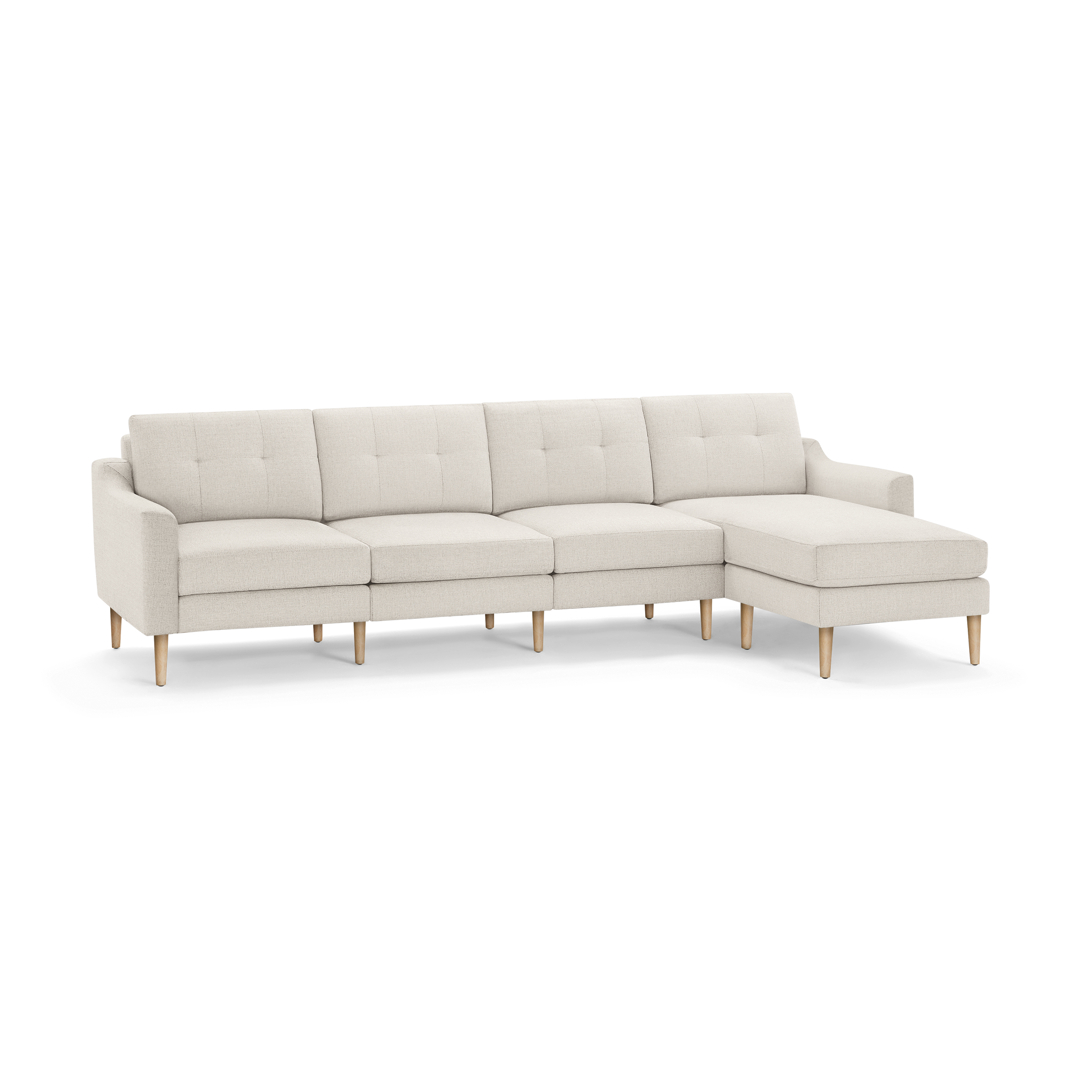 Modern beige sectional sofa with tufted cushions, wooden legs, and a right-side chaise lounge.