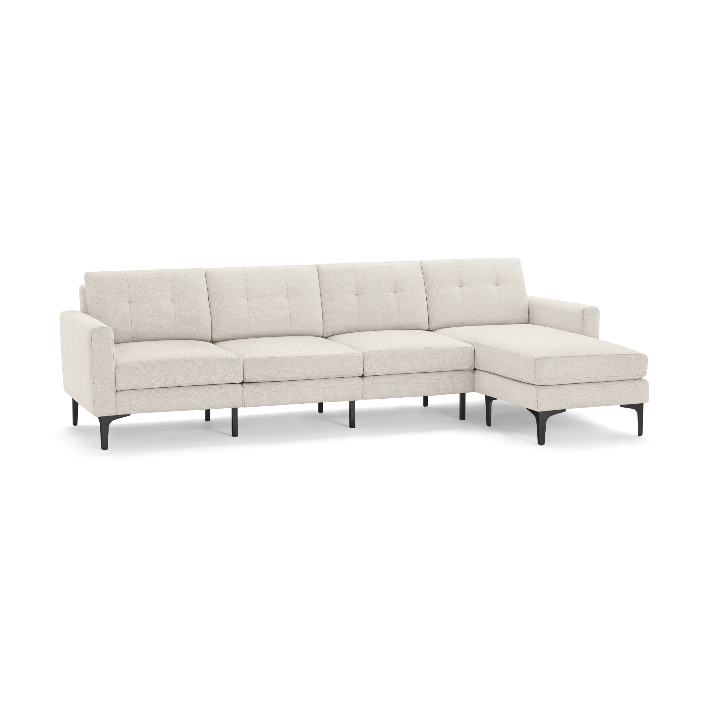 Beige modern sectional sofa with tufted back cushions, metal legs, and a right-side chaise lounge, isolated on black background.