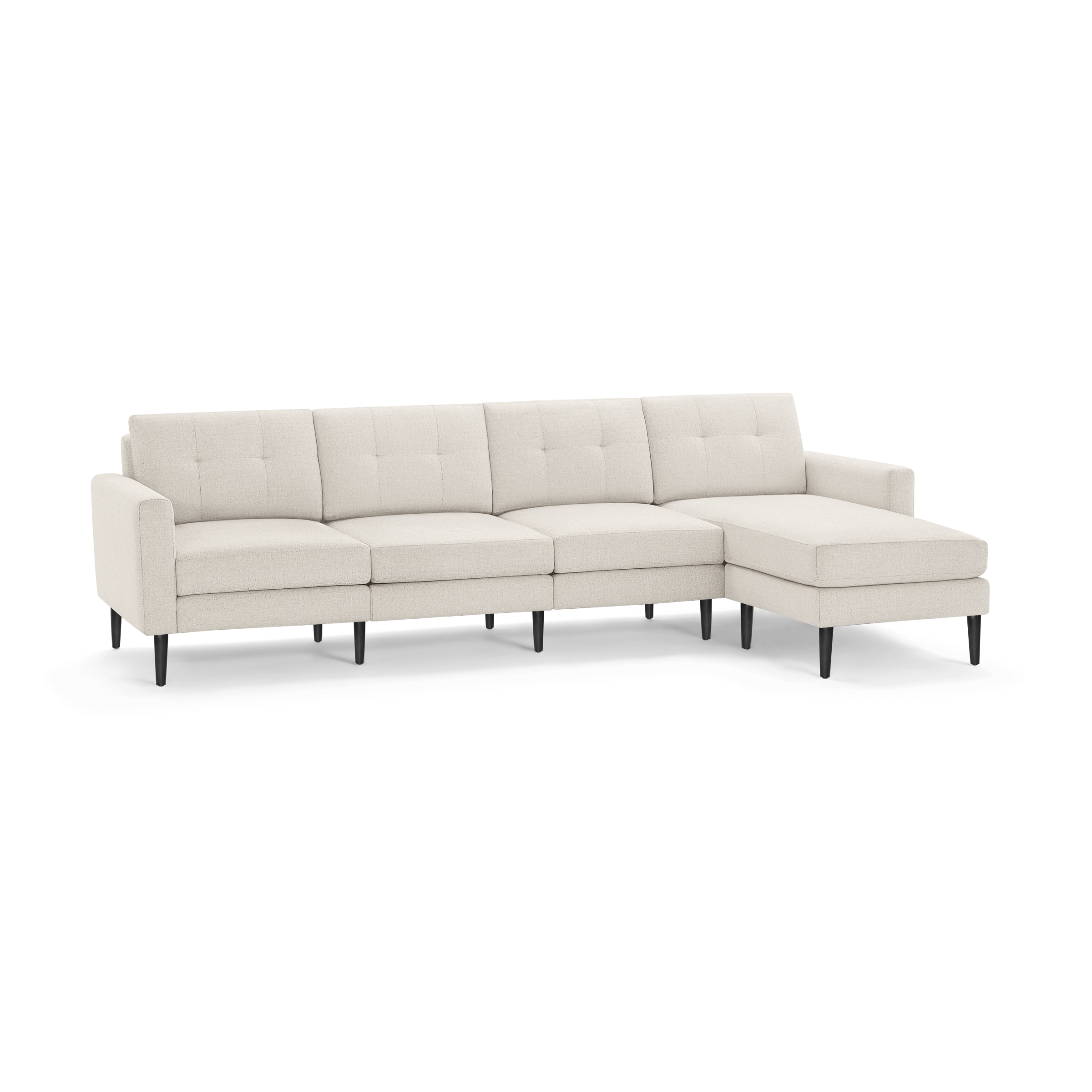 Beige fabric L-shaped sectional sofa with tufted back cushions and dark wooden legs, featuring a chaise on the right side.
