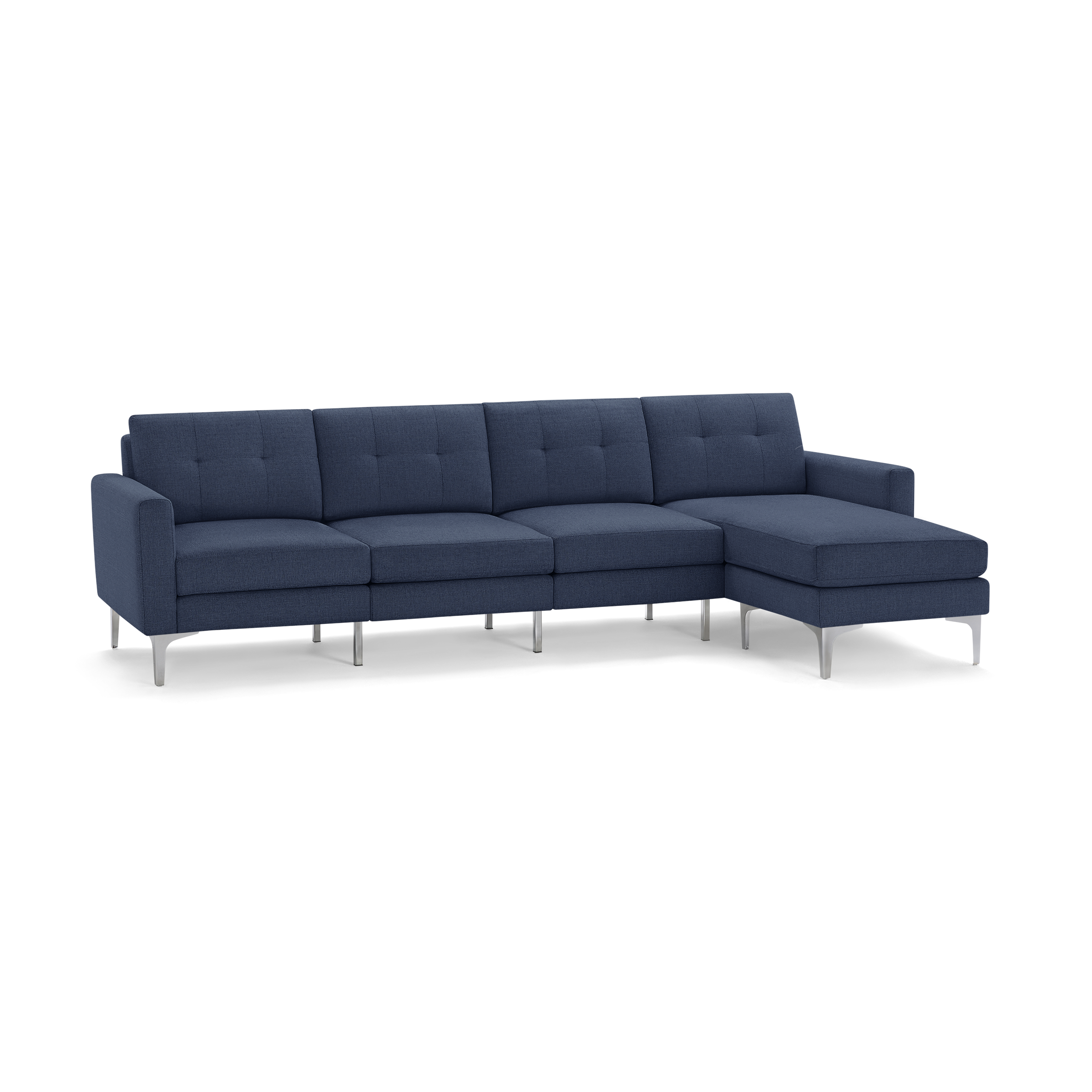 Modern sectional sofa in dark blue fabric with tufted back cushions and silver metal legs, featuring a chaise lounge on the right.