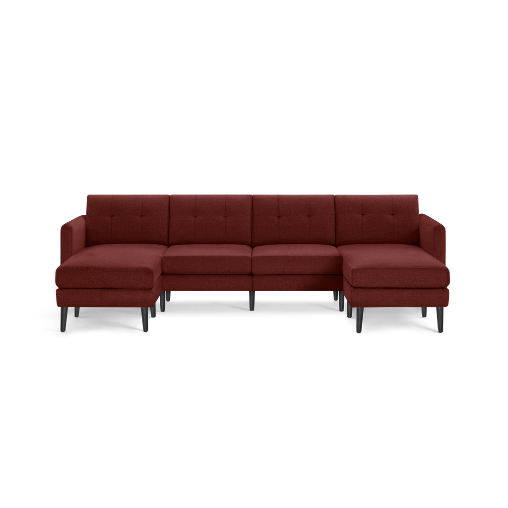 Modern large sectional sofa with deep red upholstery, tufted back cushions, and black tapered legs, featuring left and right chaise lounges.