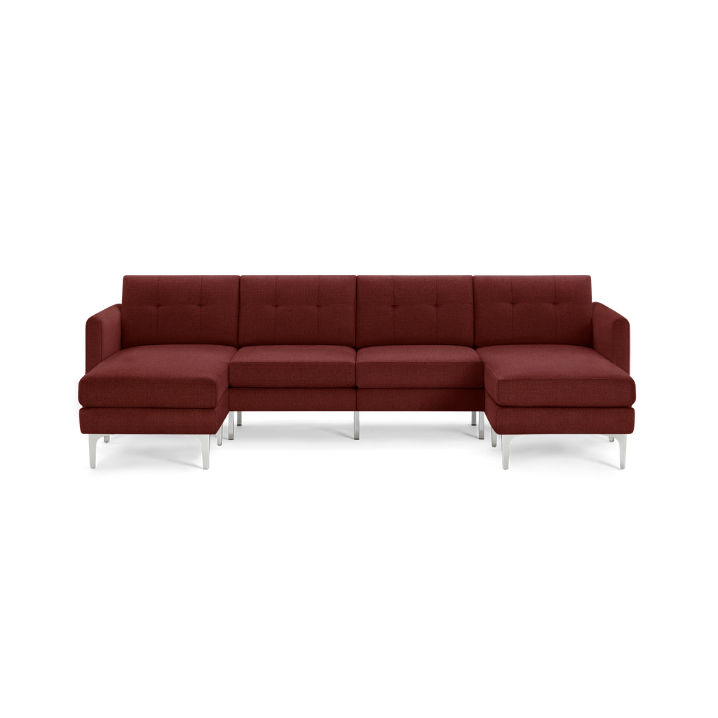 Modern sectional sofa in deep red fabric with tufted back cushions, metal legs, and chaise lounge on both ends.