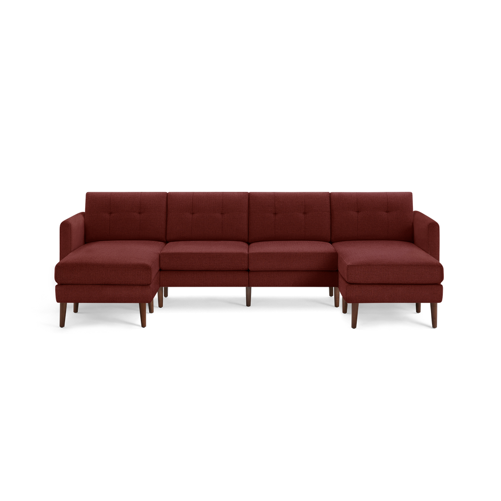 Mid-century modern sectional sofa in deep red fabric with tufted back cushions and wooden legs, featuring left and right chaise ends.