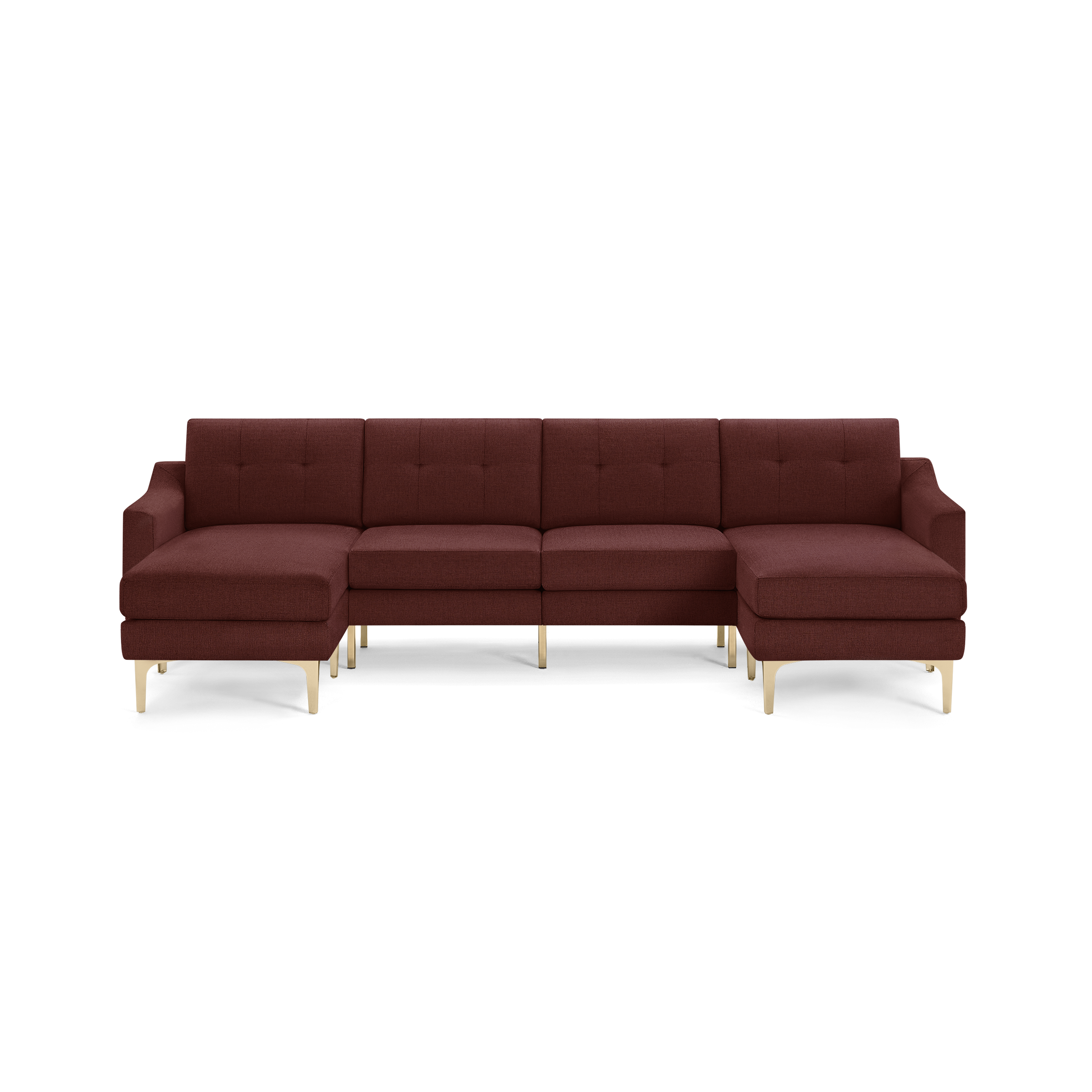 Large modern L-shaped sectional sofa upholstered in deep red fabric with gold metal legs and tufted back cushions.