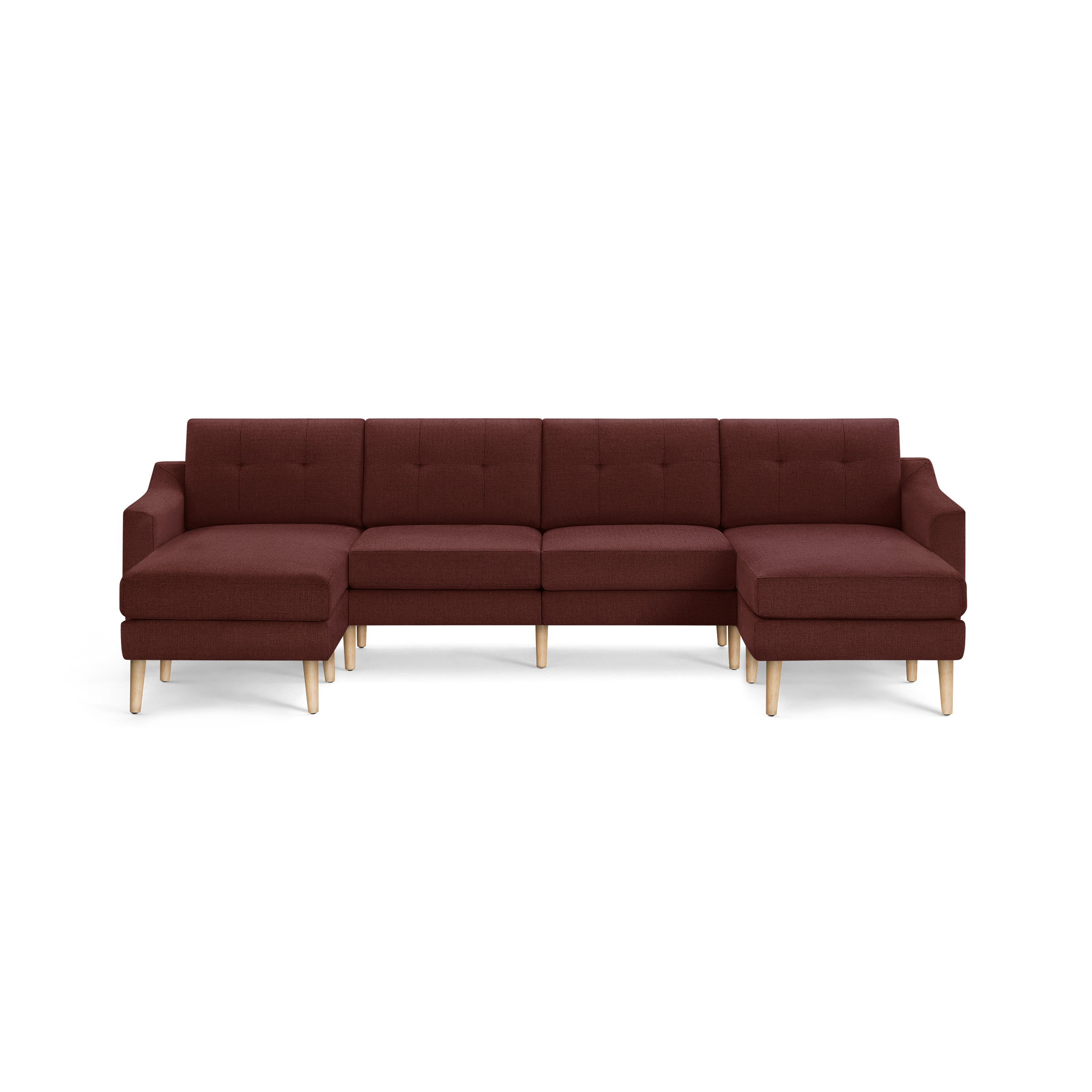 Large L-shaped sectional sofa with dark red fabric upholstery, tufted back cushions, and light wooden legs, designed for spacious seating.
