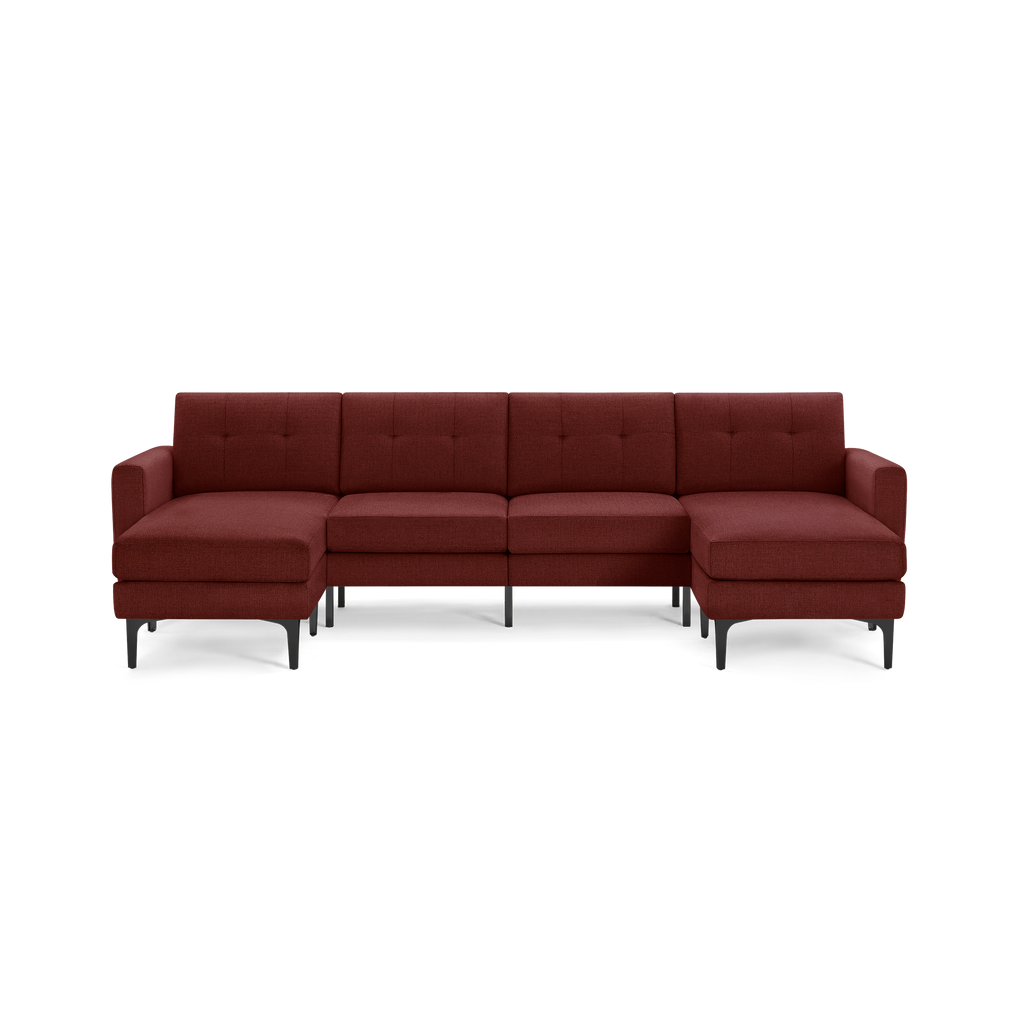 Modern maroon L-shaped sectional sofa with tufted backrests, wide armrests, and black metal legs, designed for spacious seating.