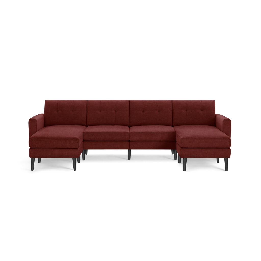 Modern sectional sofa with deep red fabric upholstery, tufted back cushions, right- and left-sided chaise lounges, and black tapered legs.
