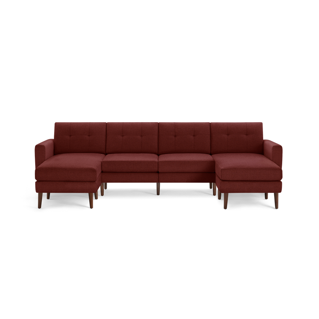 Modern sectional sofa in deep red fabric with tufted back cushions and wooden tapered legs, featuring two chaise lounge ends.
